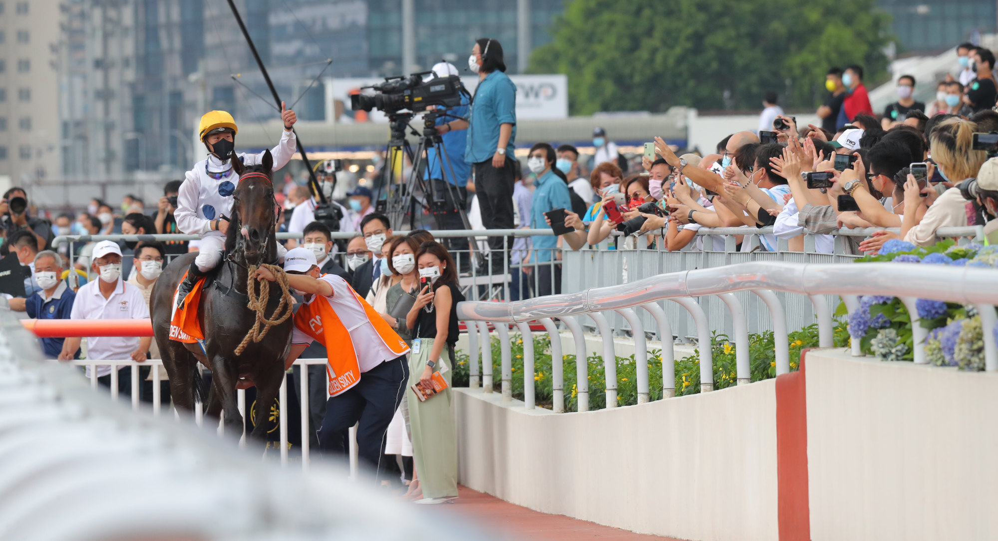 Vincent Ho acknowledges the fans after Golden Sixty’s win in the Champions Mile.