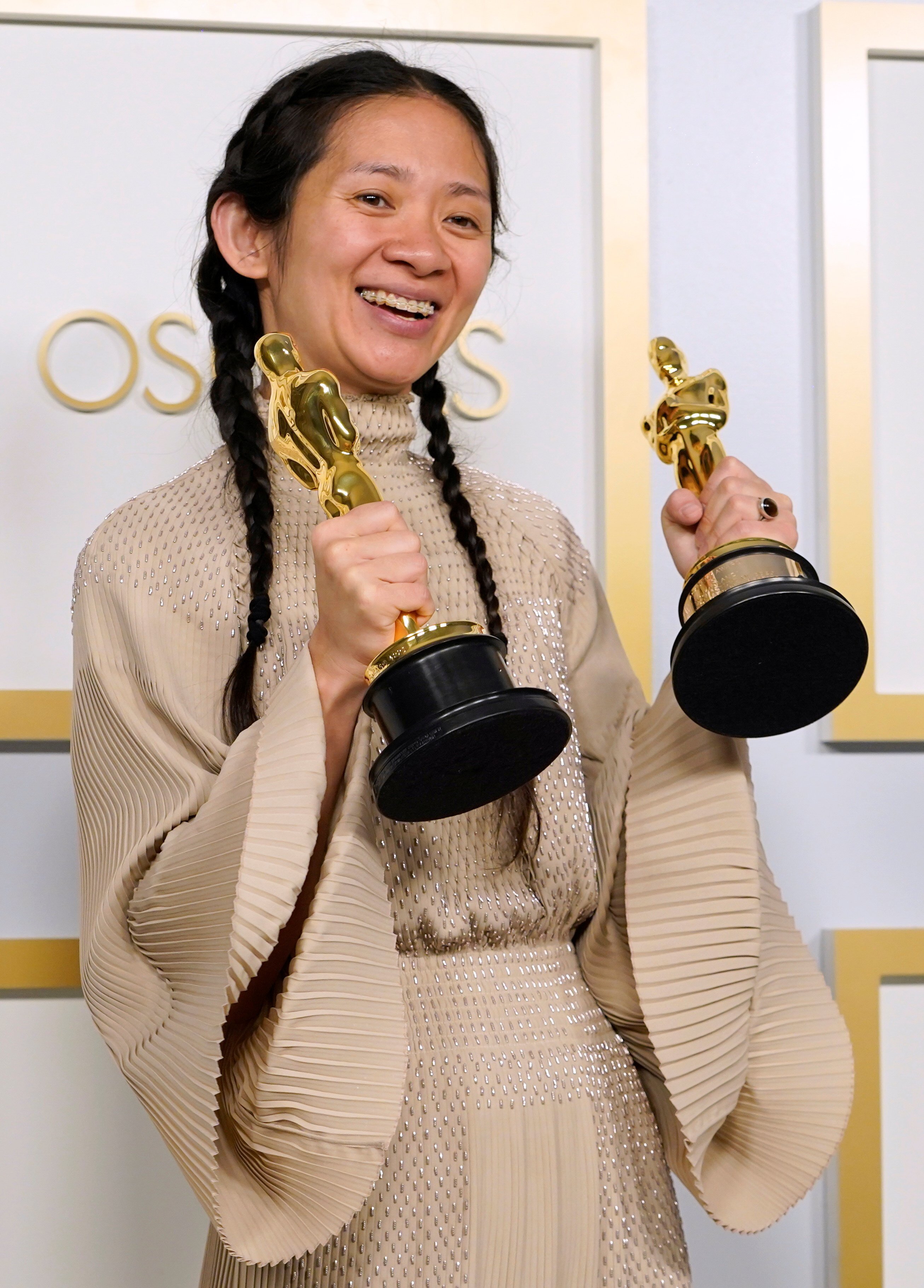 Chloé Zhao shows off her Oscars for best picture and director for Nomadland, but the news went unheralded in China. Photo: AP