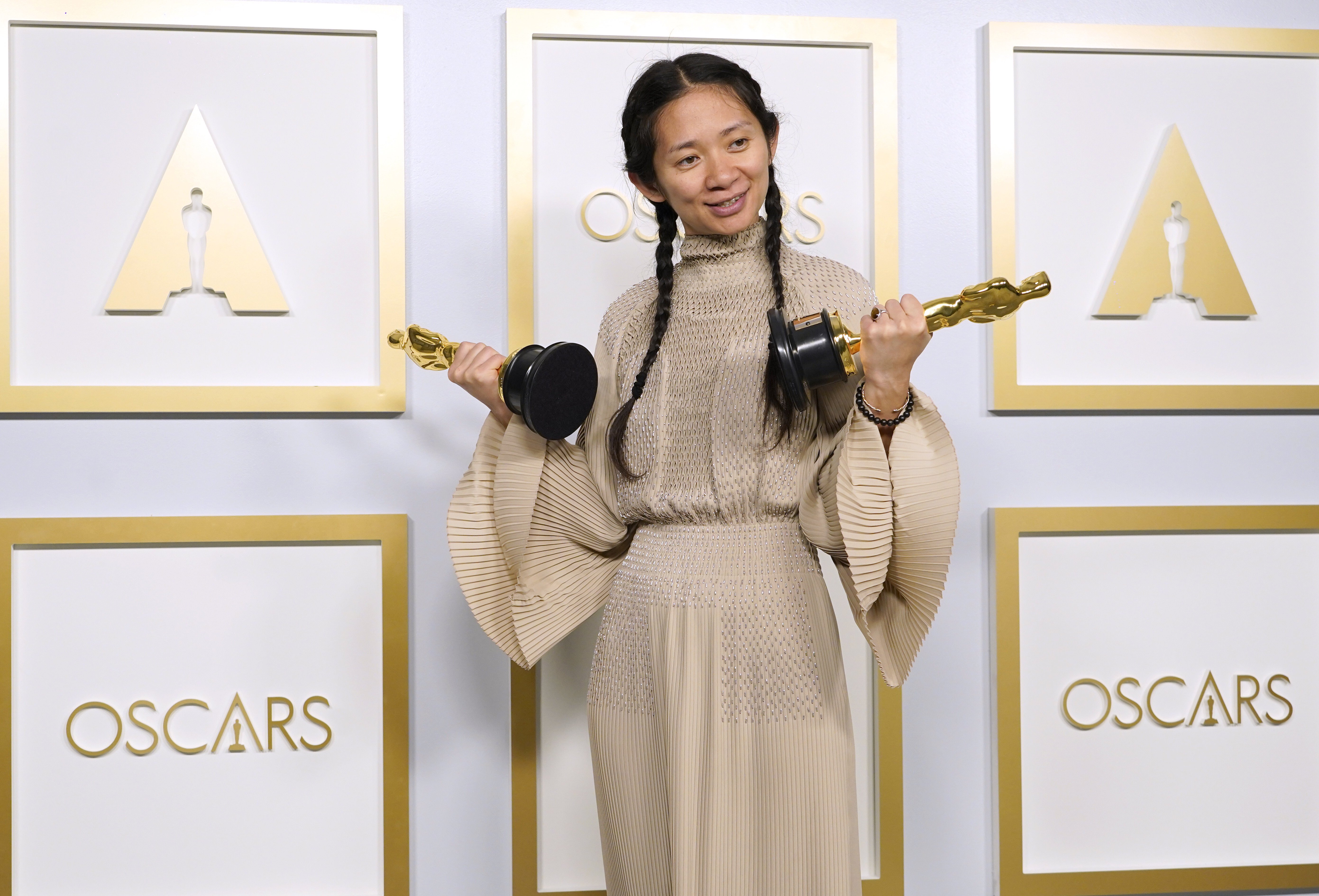 Chloé Zhao with her Oscars for best picture and director for Nomadland. Photo: AP