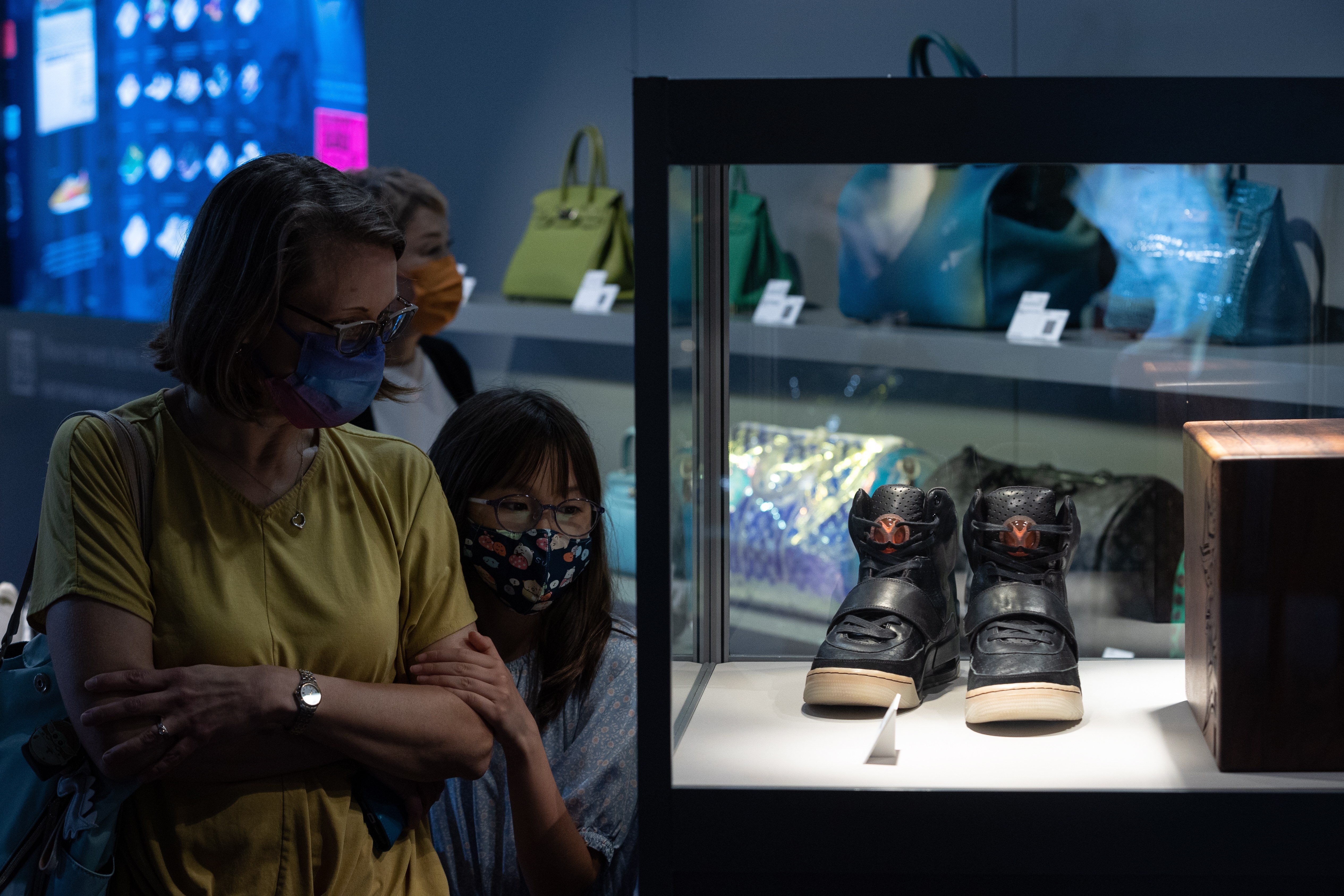 Visitors look at Kanye West’s Grammy-worn Nike Air Yeezy 1 Prototype sneakers on display during a Sothebys auction preview in Hong Kong on April 17. Photo: EPA-EFE