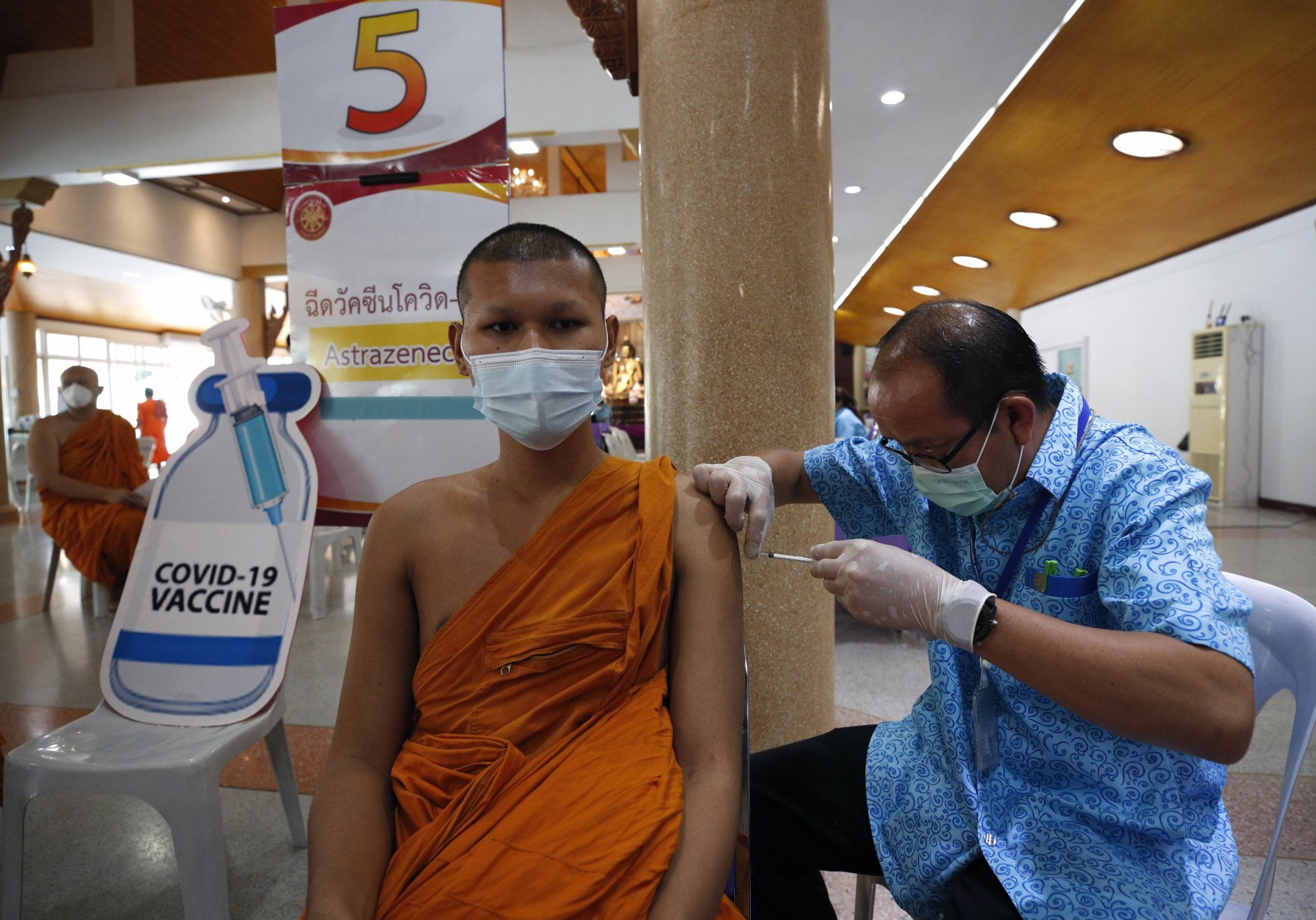 A Thai Buddhist monk receives a shot of the AstraZeneca Covid-19 vaccine in Bangkok. Photo: EPA