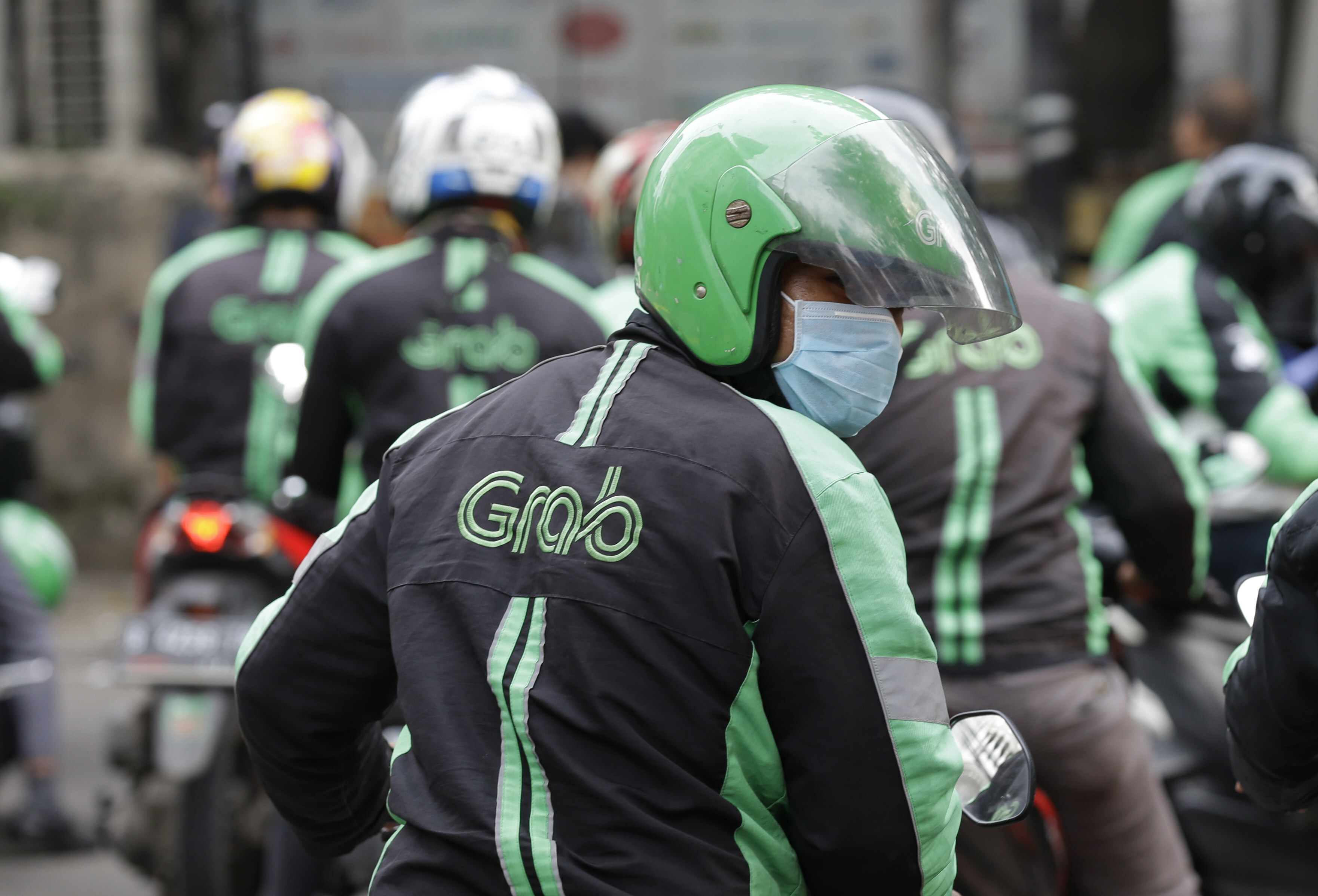 A GrabBike driver in Indonesia in 2018. Grab is set to become the most valuable publicly listed technology company from Southeast Asia following a blockbuster merger with a special purpose acquisition company. Photo: AP 