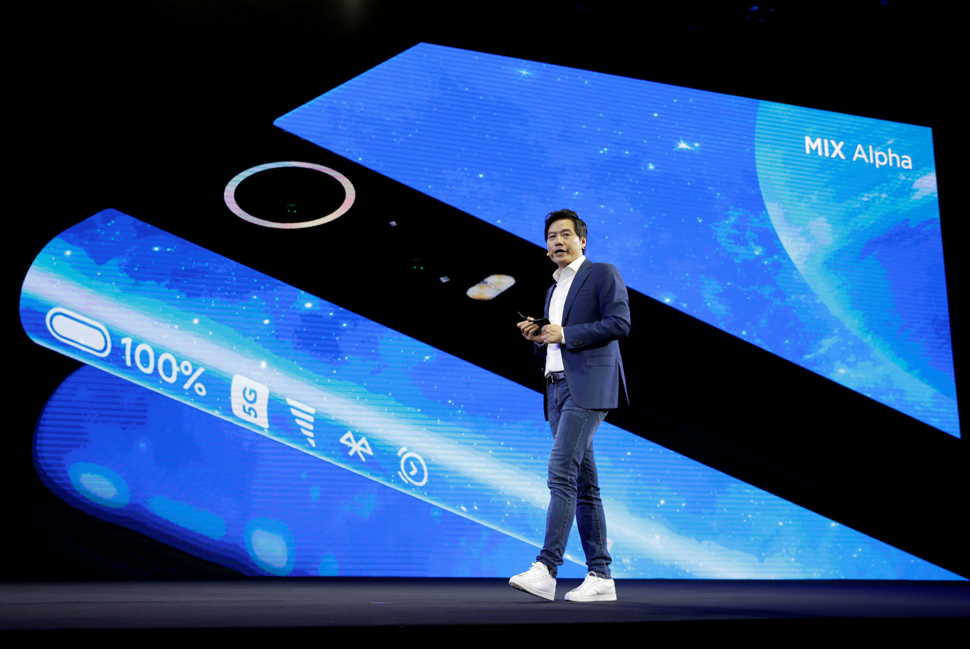 Xiaomi CEO Lei Jun unveils the Mi MIX Alpha, an experimental 5G smartphone that is almost all screen, front and back, in Beijing on September 24, 2019. Photo: Reuters