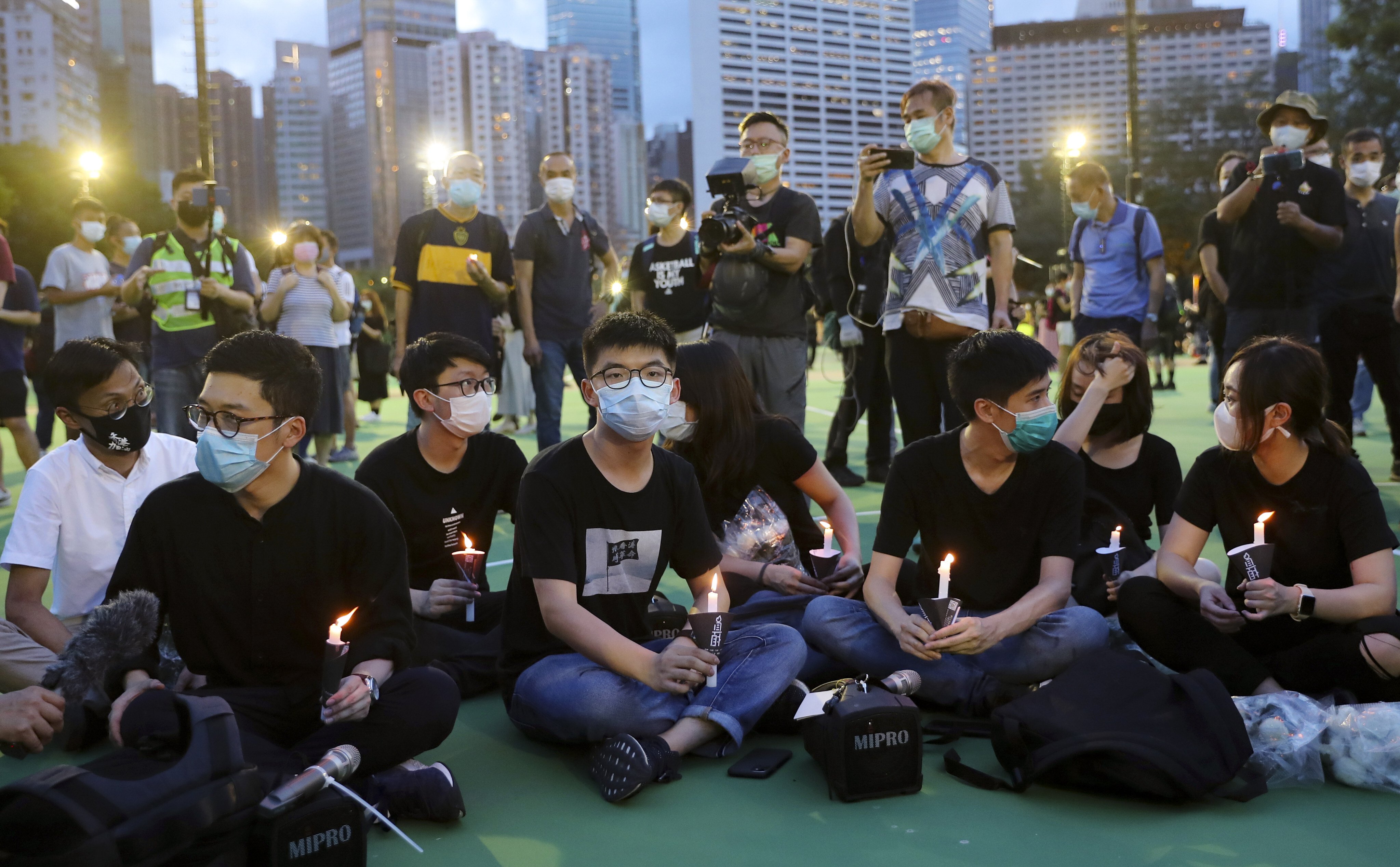 Hong Kong activist Joshua Wong (centre) pleaded guilty on Friday to taking part in a banned Tiananmen Square vigil on June 4, 2020. Photo: Sam Tsang