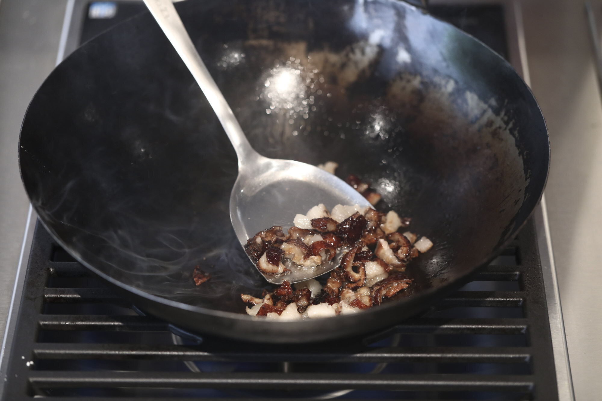 Cook the goose fat and skin to render out the liquid fat. Photo: Jonathan Wong