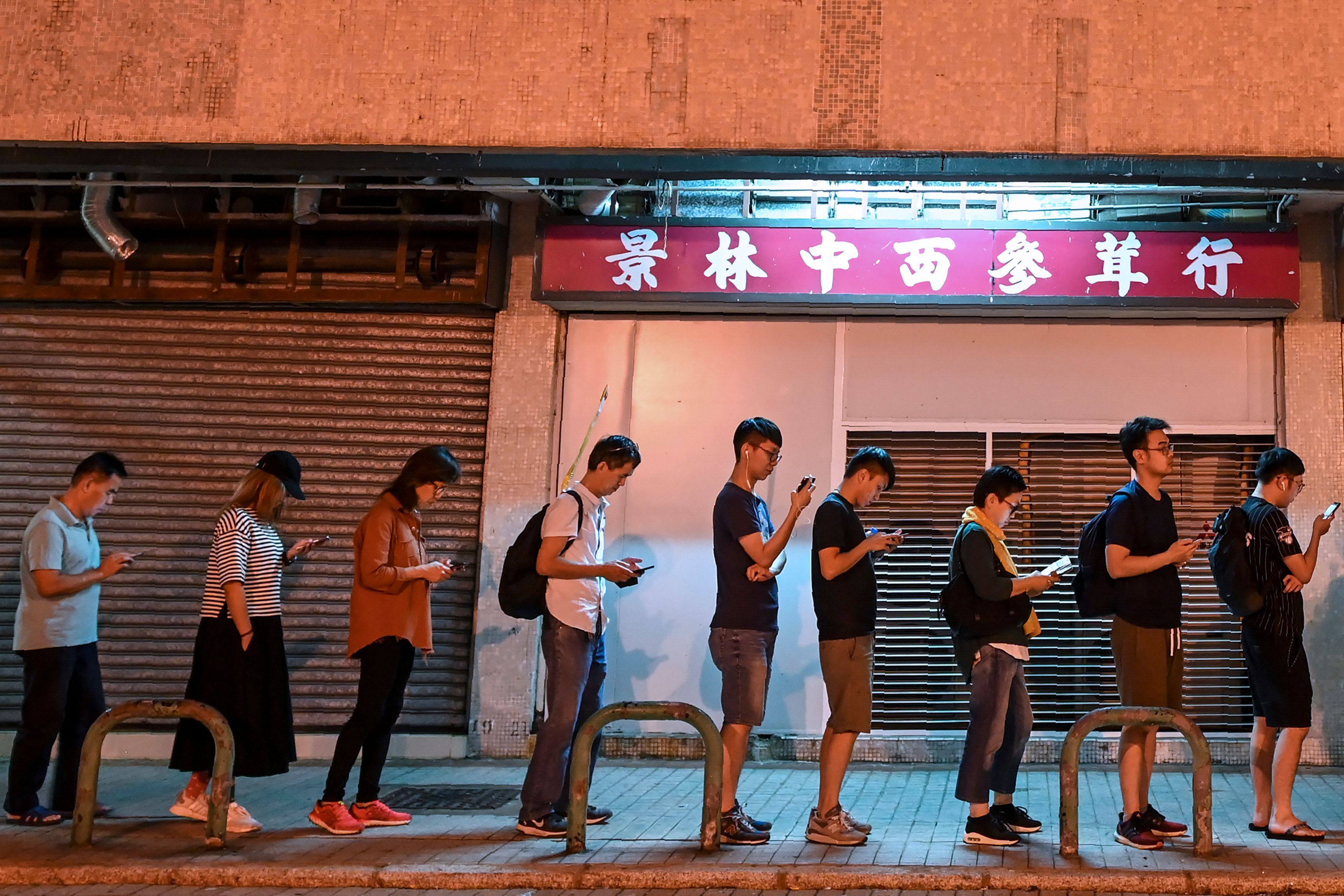 People queue to cast their votes in the 2019 district council elections in Tseung Kwan O, Hong Kong. Photo: AFP