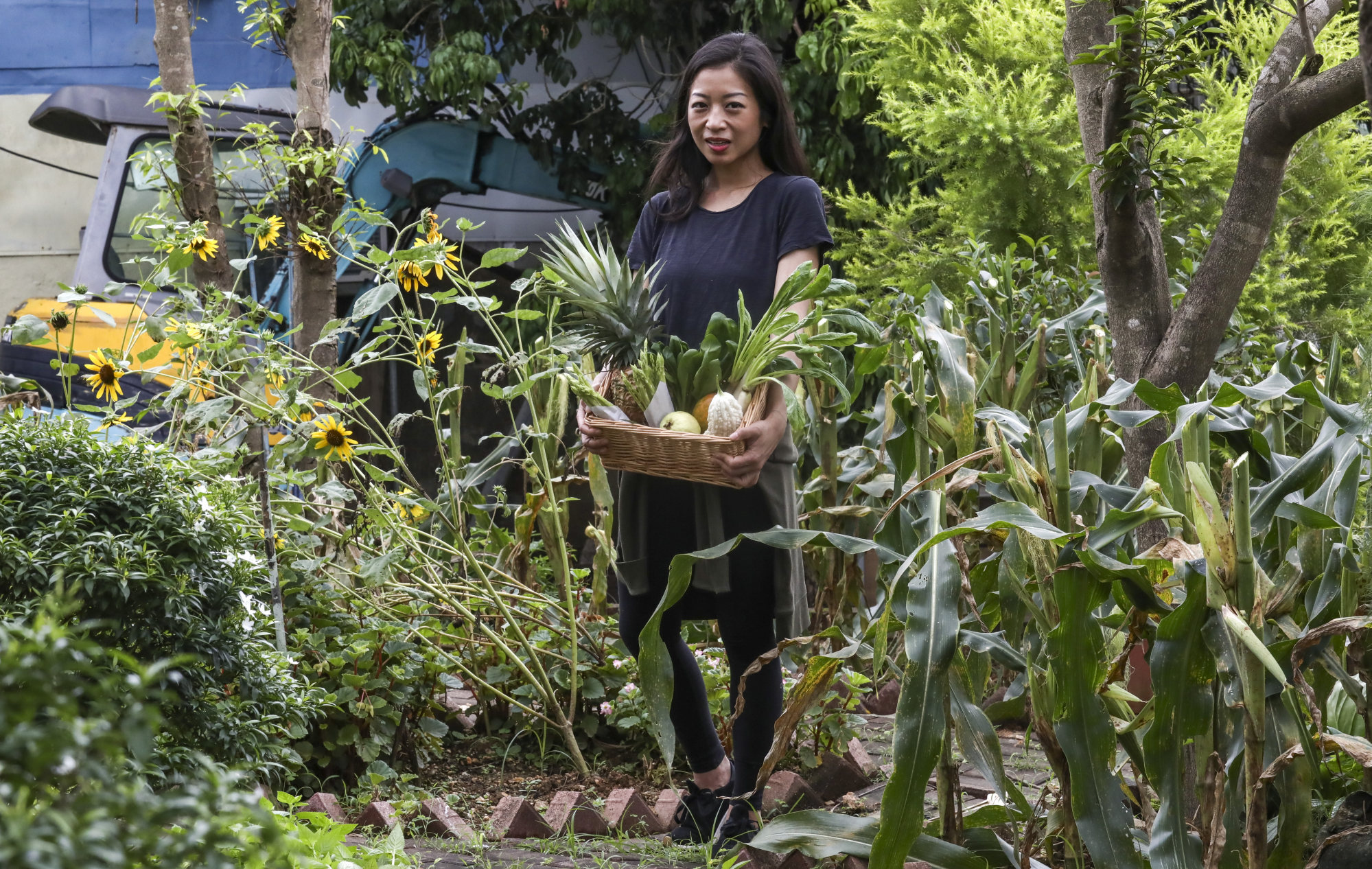 Peggy Chan was previously the founder and chef of Nectar, and is seen here with fresh produce grown at the Zen Organic Farm in Ta Kwu Ling, Hong Kong, in 2019. Photo: SCMP