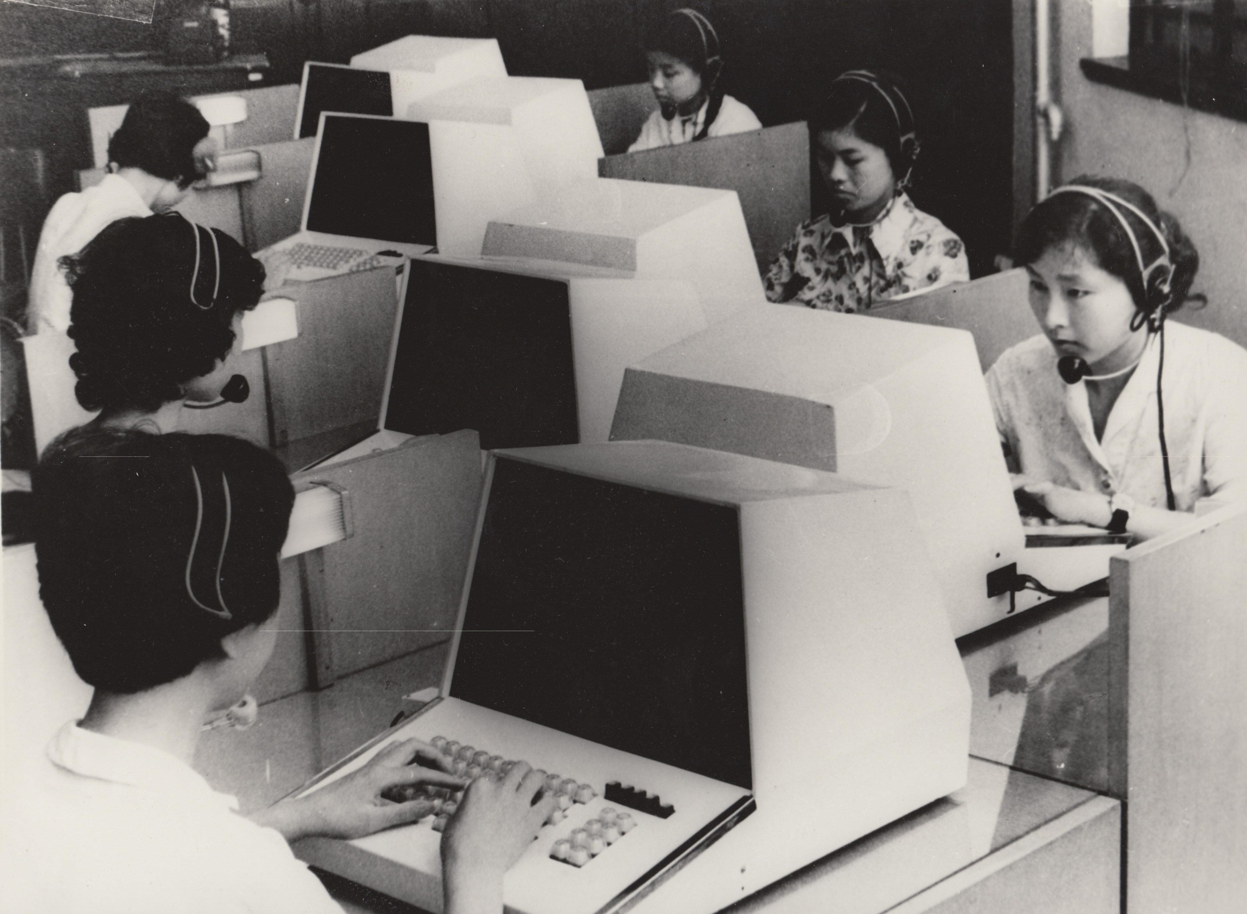 Telephone operators in Shanghai using new microcomputers to help clients  (1980s)
