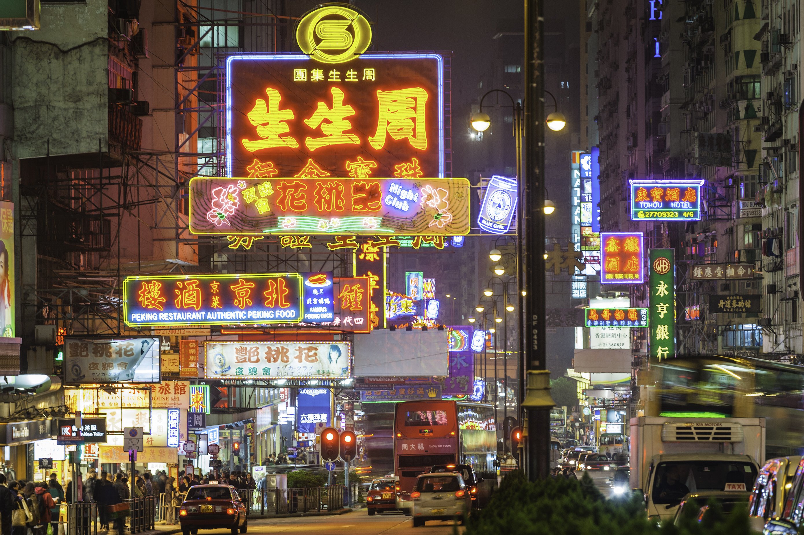 Neon signs and street lights glow above a busy night scene along Nathan Road in the crowded Tsim Sha Tsui district of Kowloon, Hong Kong. Photo: Getty Images