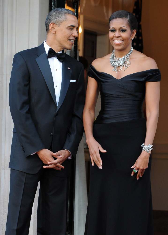 Former US president Barack Obama and first lady Michelle Obama wait to greet Britain’s Queen Elizabeth and Prince Philip, the Duke of Edinburgh, for a reciprocal dinner at Winfield House in London, in May 2011. Photo: AFP Photo