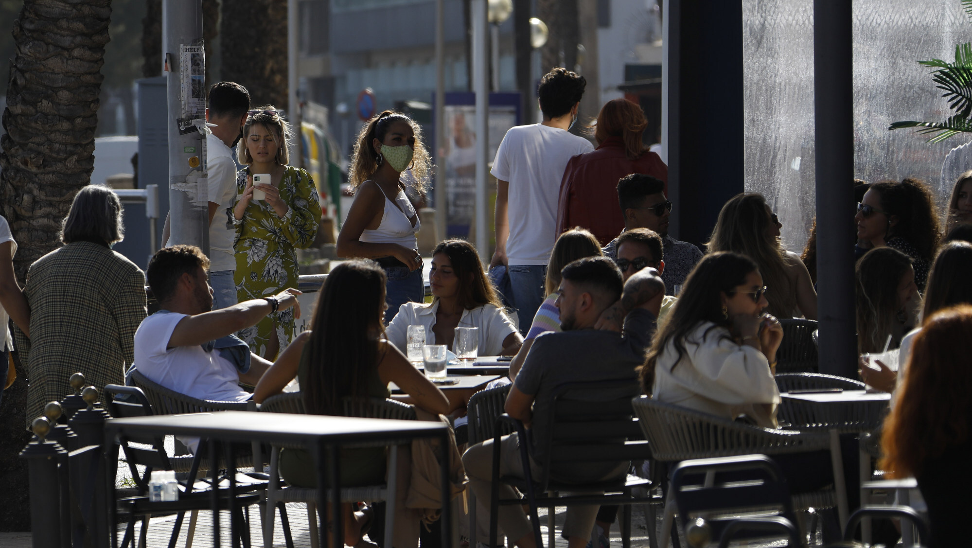 Customers sit on the terrace of a bar in the resort city of Palma, Spain, on May 9. Spain has lifted the six-month-long national state of emergency and curfew, imposed to curb the the coronavirus spread. Photo: dpa