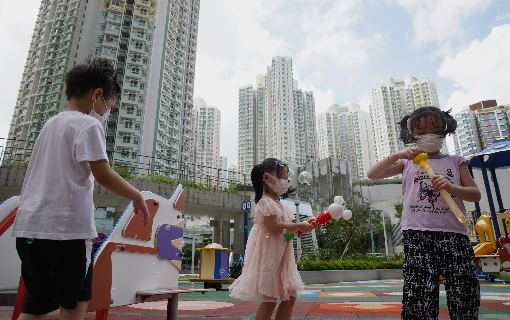 Children play in a playground at a housing estate in Kai Tak. Photo: Winson Wong