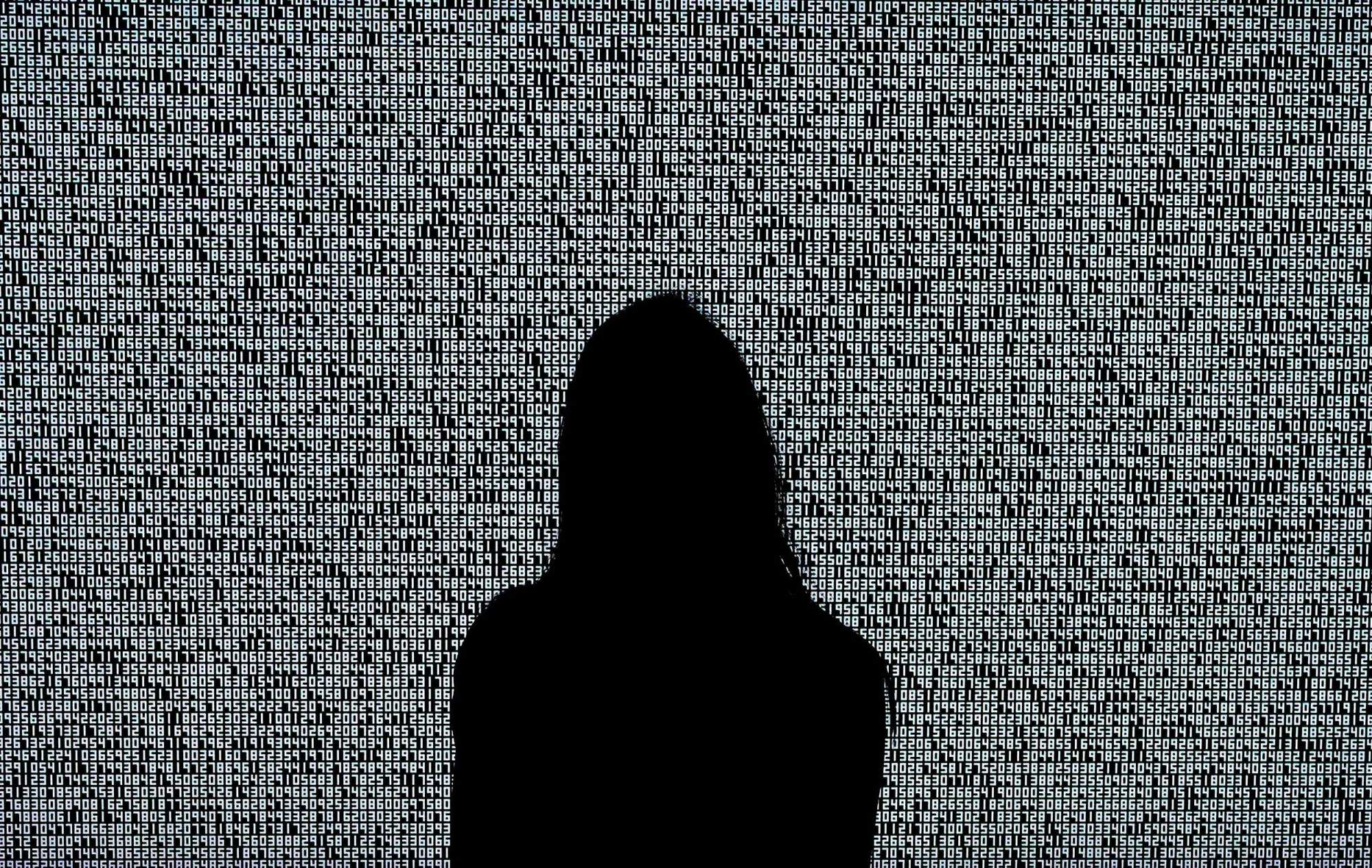 A woman looks at a NFT by Ryoji Ikeda titled “A Single Number That Has 10,000,086 Digits” during a media preview on June 4, 2021, at Sotheby’s. Photo: AFP