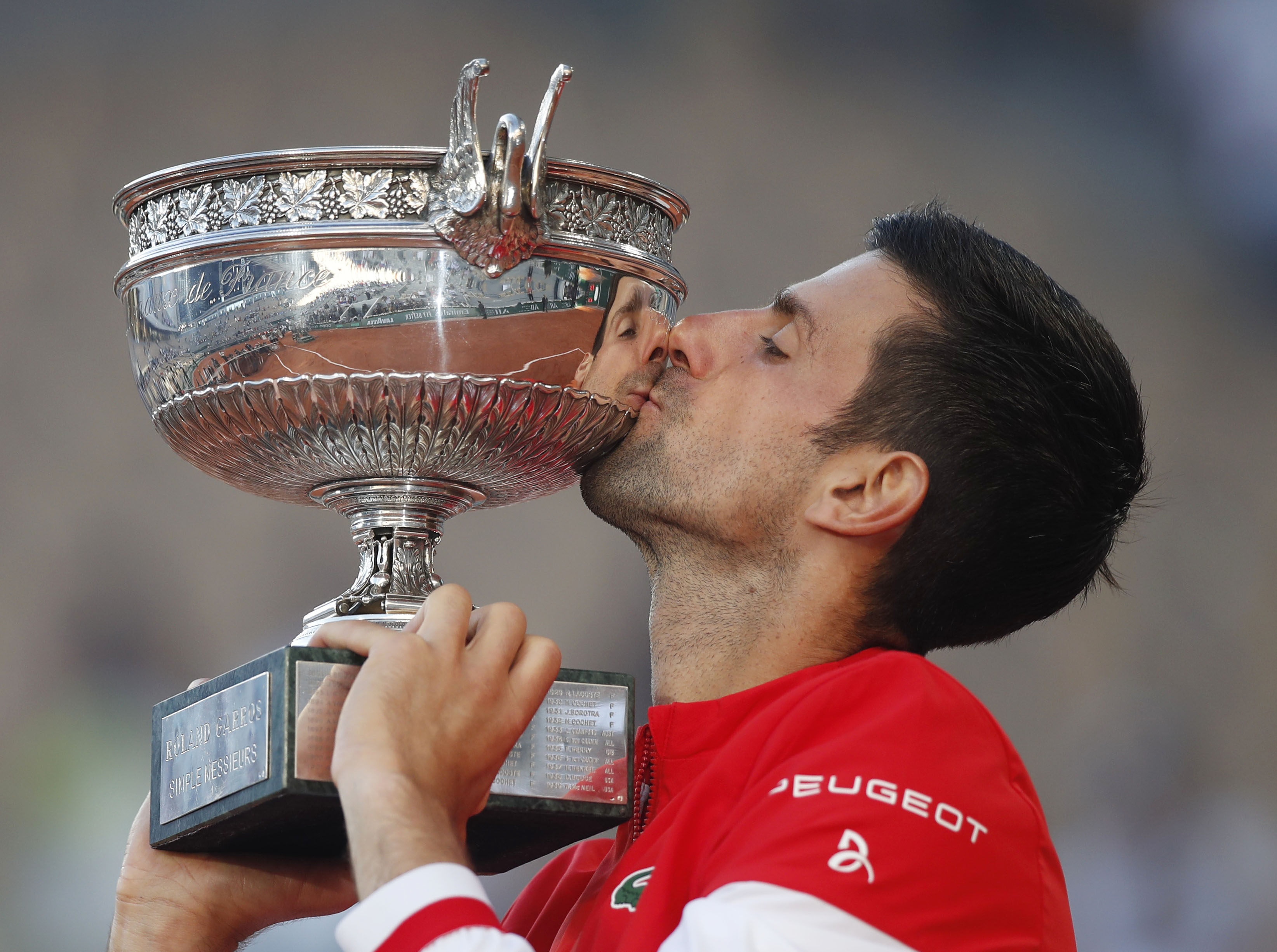 Serbia’s Novak Djokovic celebrates with his trophy after winning the French Open against Greece’s Stefanos Tsitsipas at Roland Garros stadium in Paris, France on Sunday. Photo: Reuters