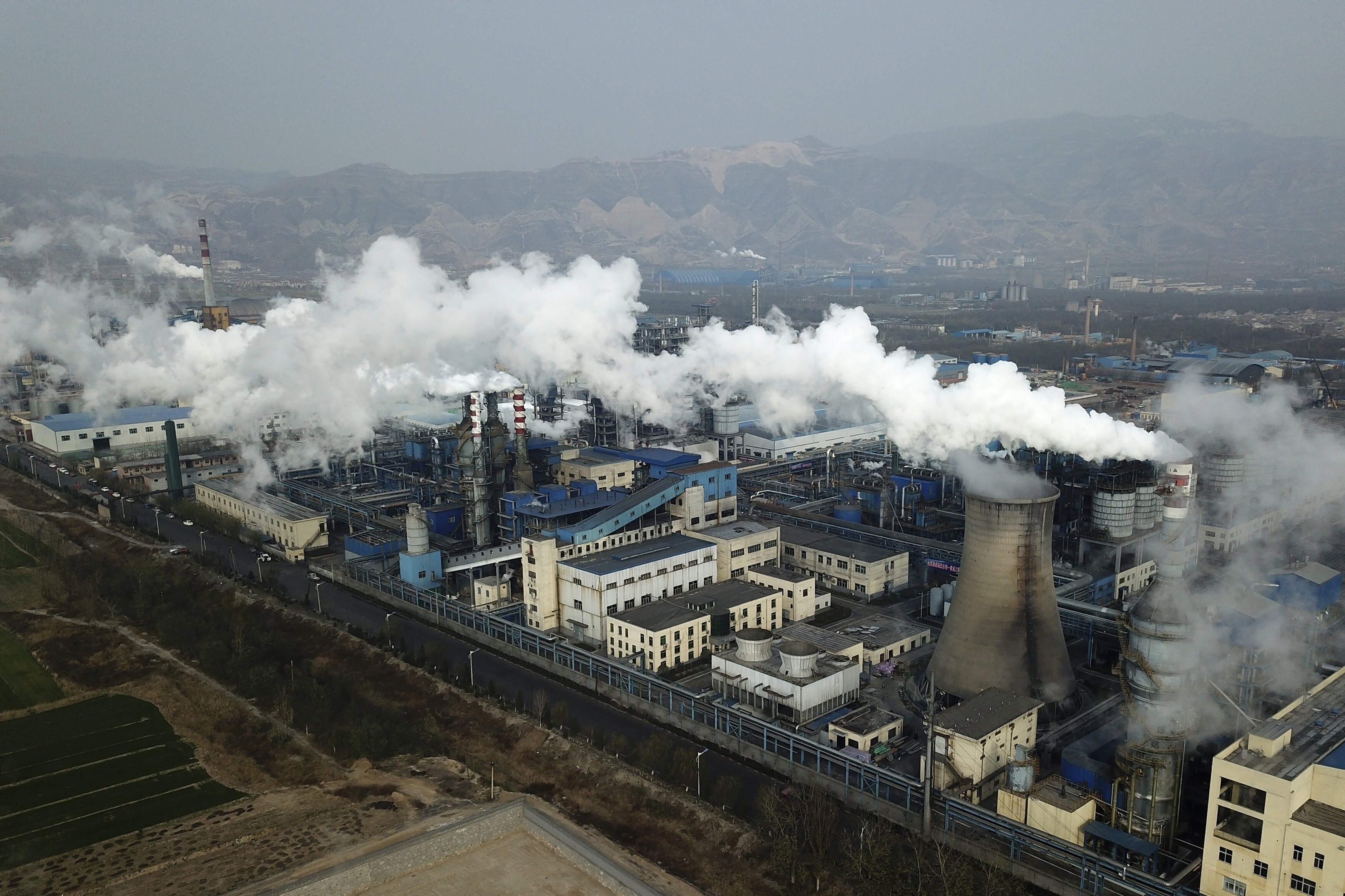 Smoke and steam rise from a coal processing plant in Hejin in central China’s Shanxi province. China is the world’s largest emitter of carbon dioxide. Photo: AP Photo