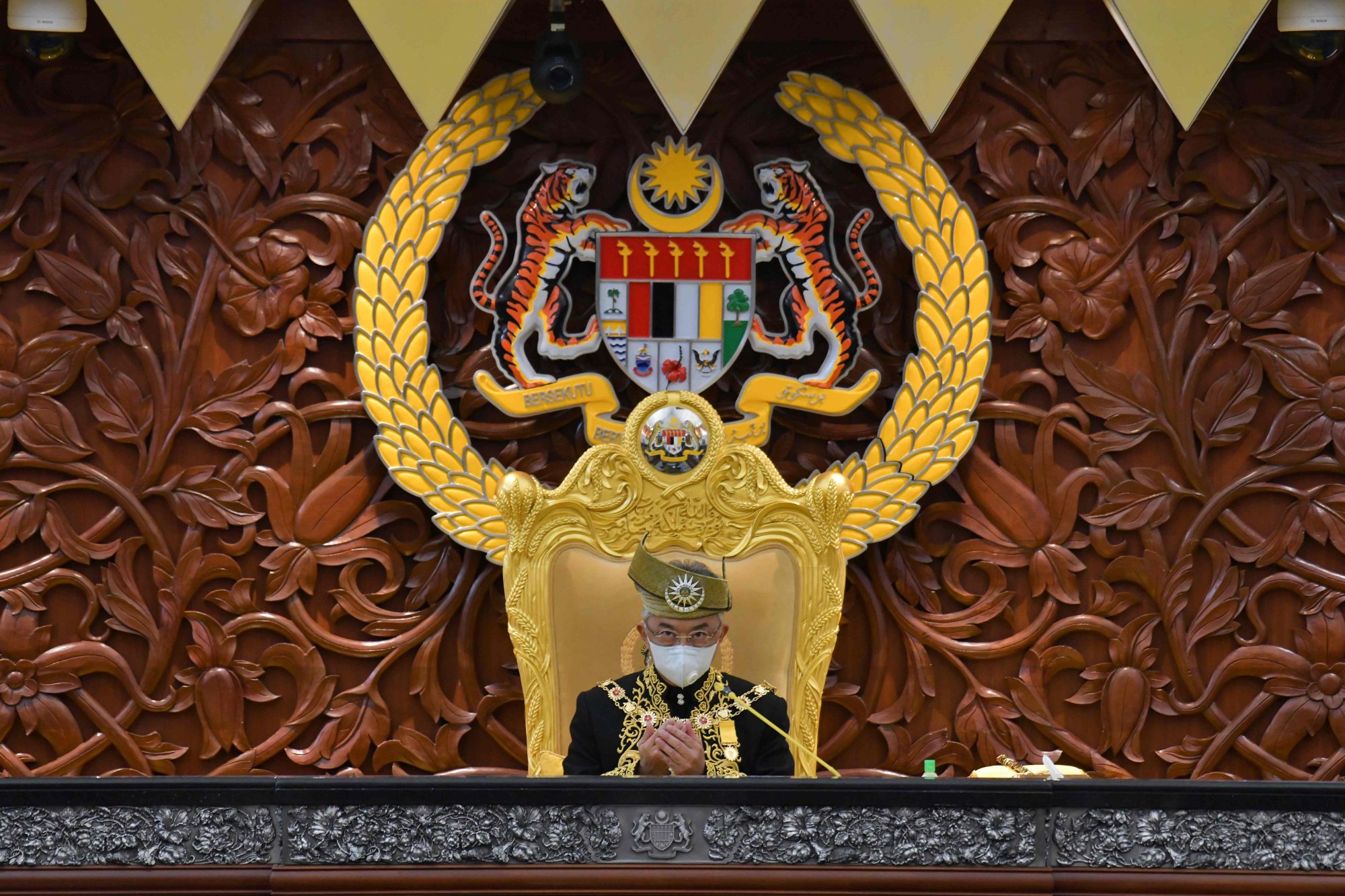 Malaysia’s king, Sultan Abdullah Sultan Ahmad Shah, offers prayers during the opening ceremony for a term of parliament in 2020. Photo: AFP