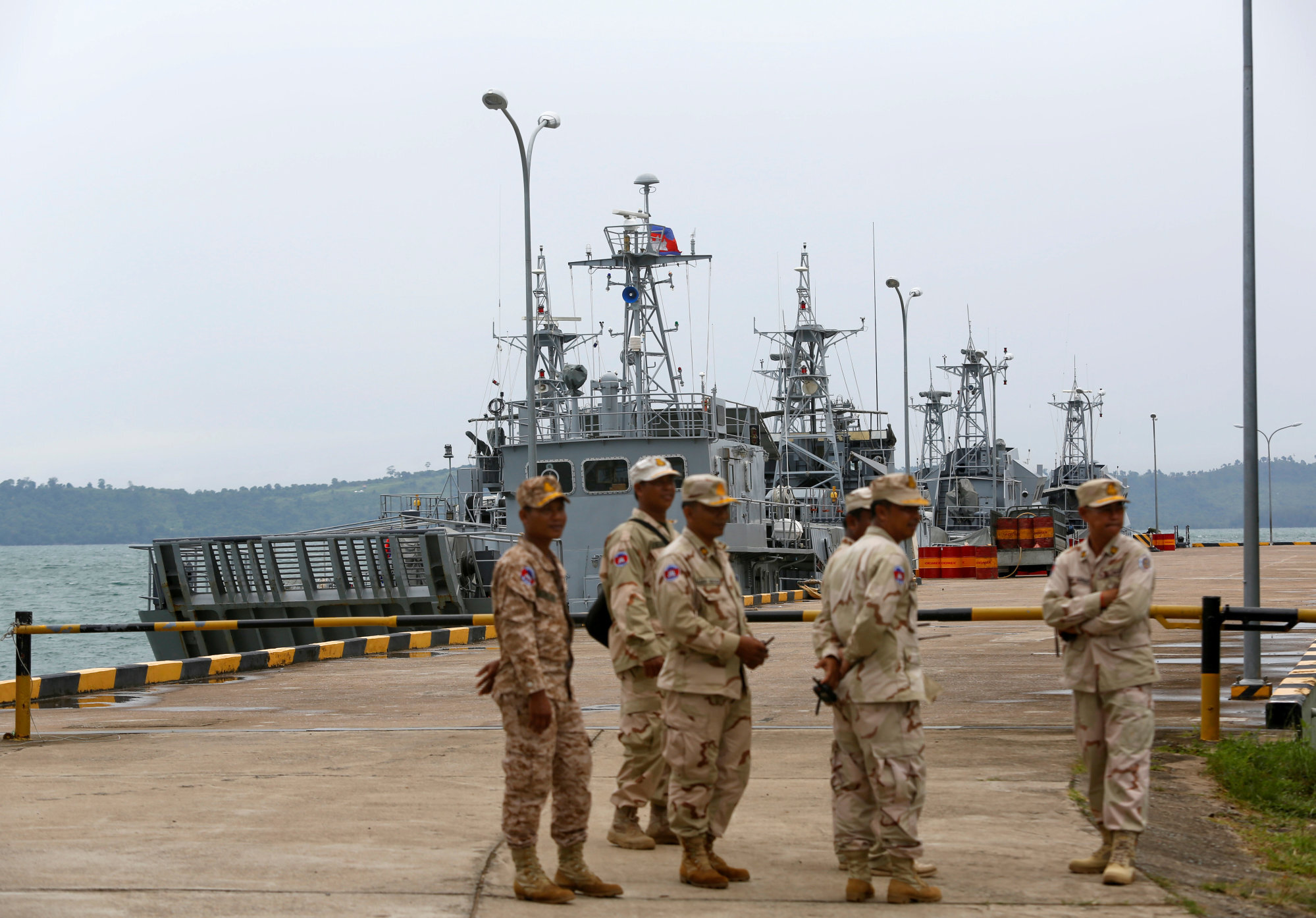 Sailors stand guard near patrol boats at the Ream Naval Base in 2019. Photo: Reuters