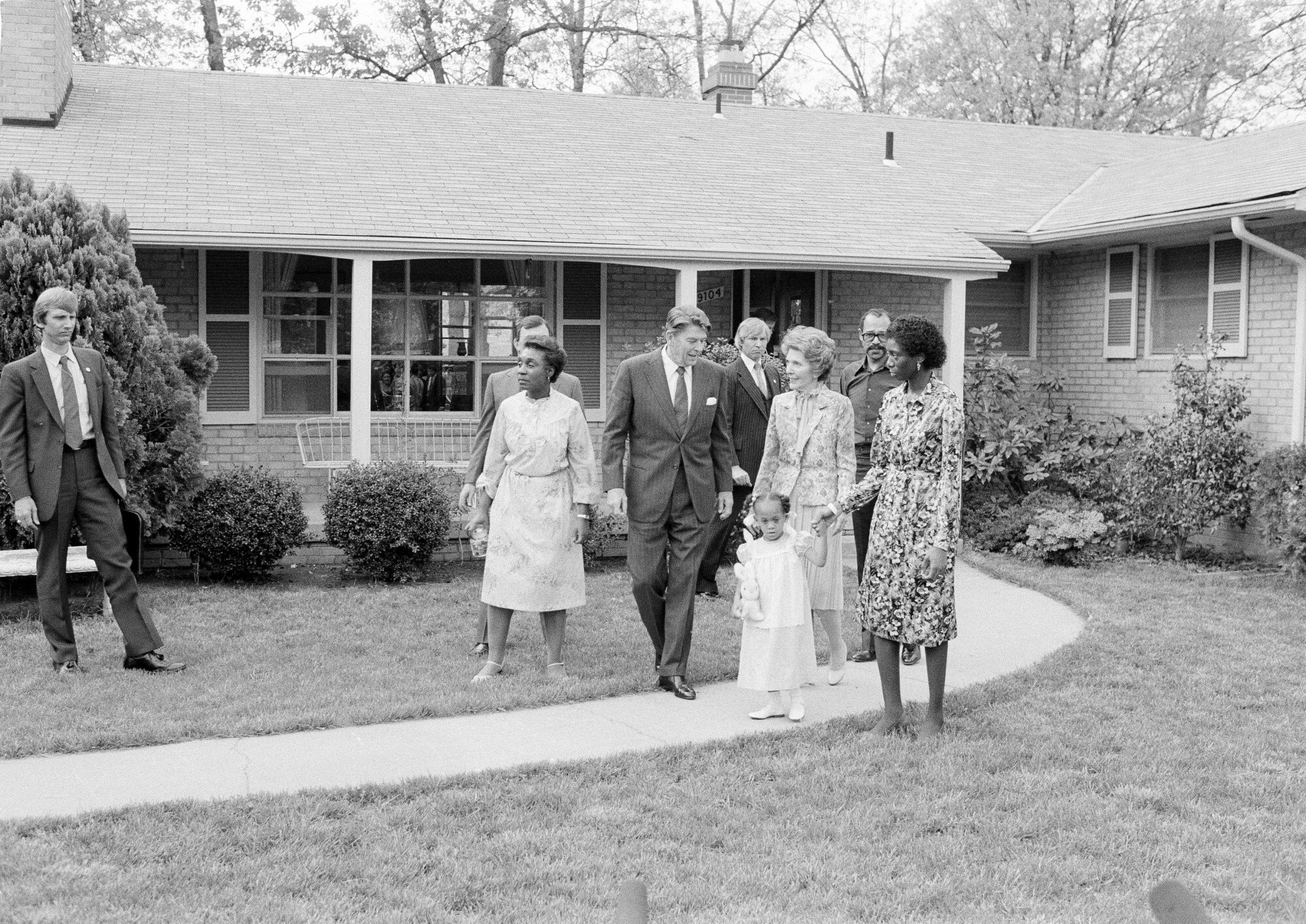 President Ronald Reagan and first lady Nancy Reagan with the Butler family, outside their home in College Park, Maryland in May 1982. Photo: AP Photo