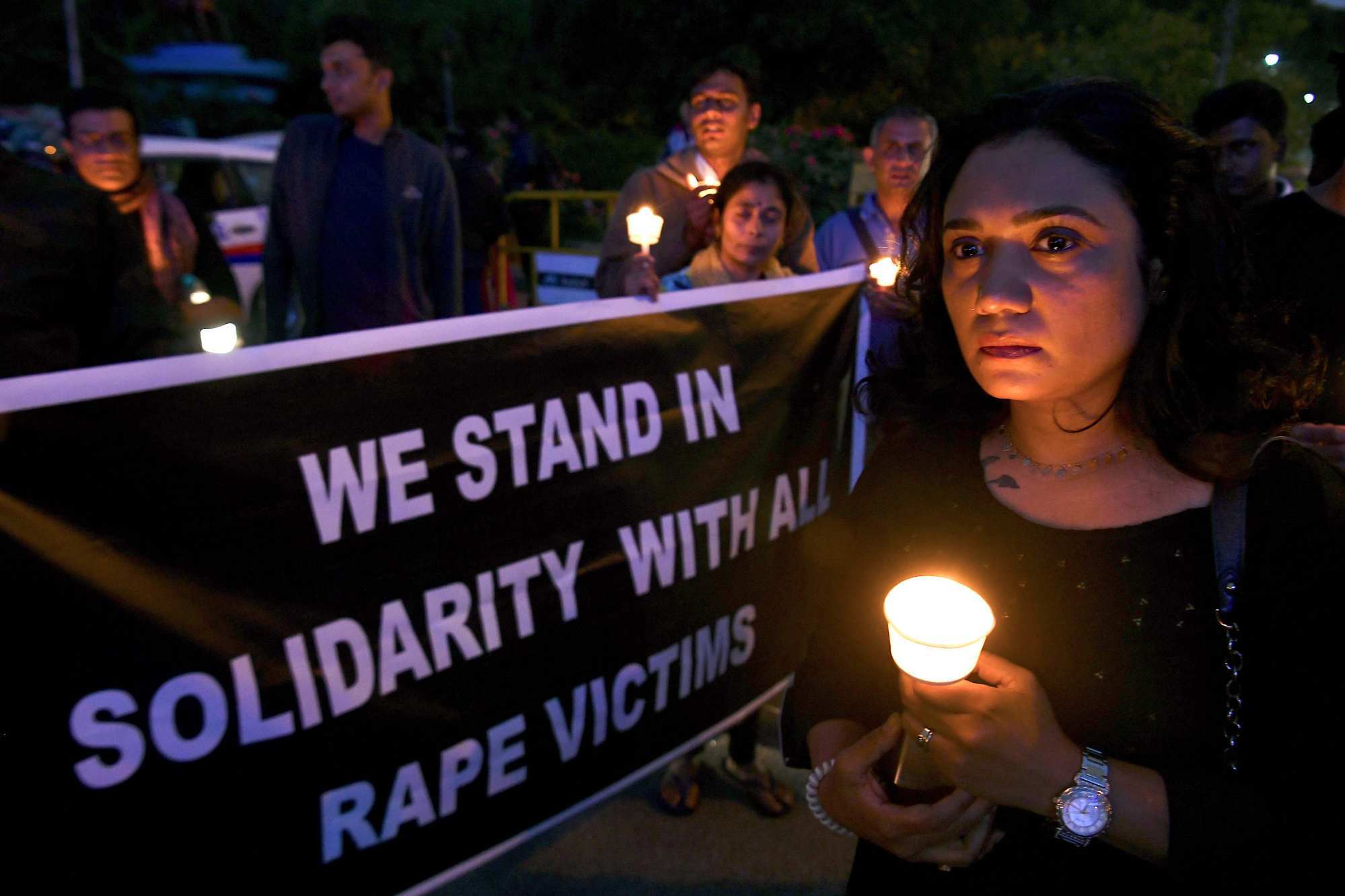 People hold a candlelight vigil in support of sexual assault survivors in Hyderabad on December 6, 2019. Photo: AFP