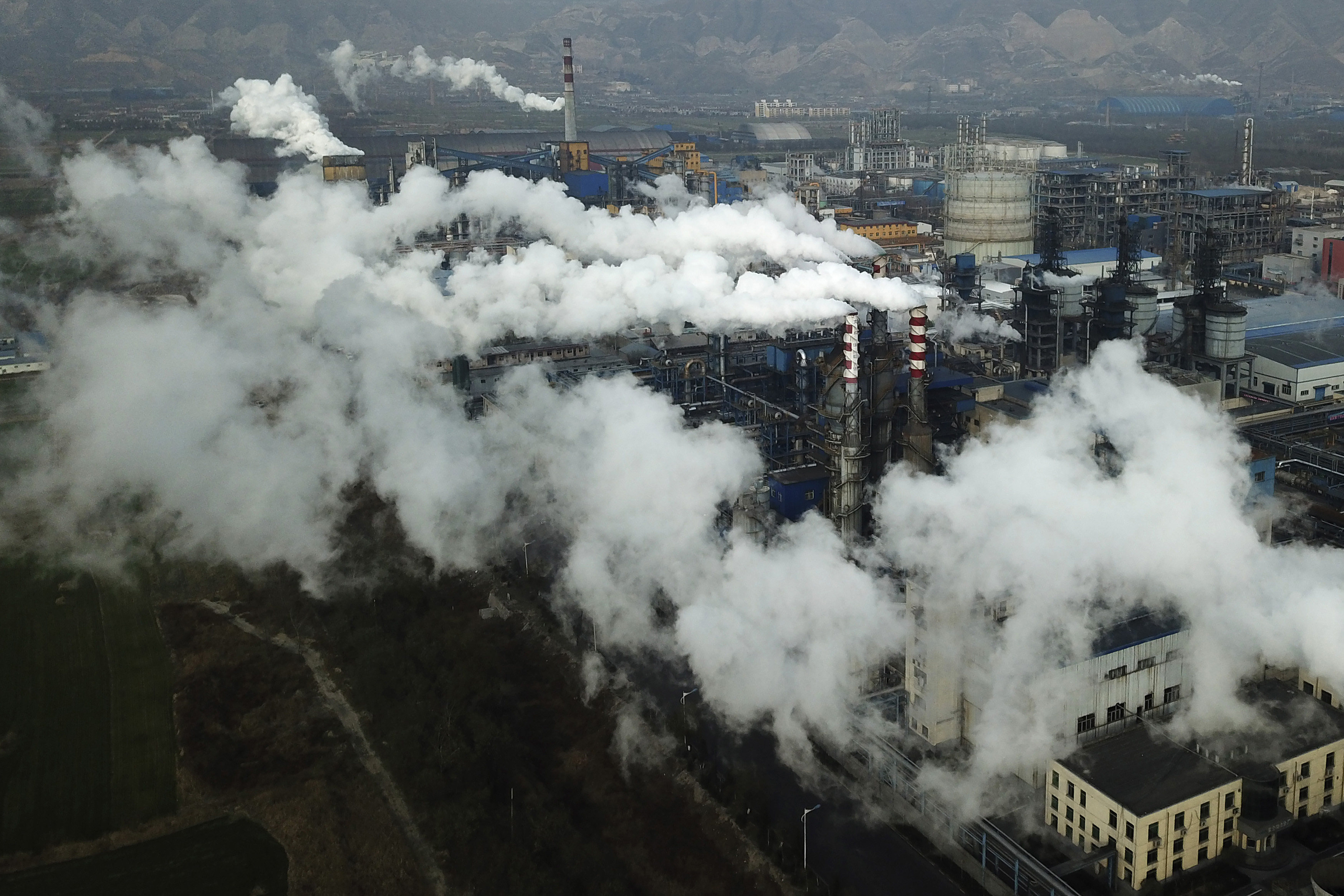 Smoke and steam rise from a coal processing plant in Hejin in central China’s Shanxi Province. Photo: AP