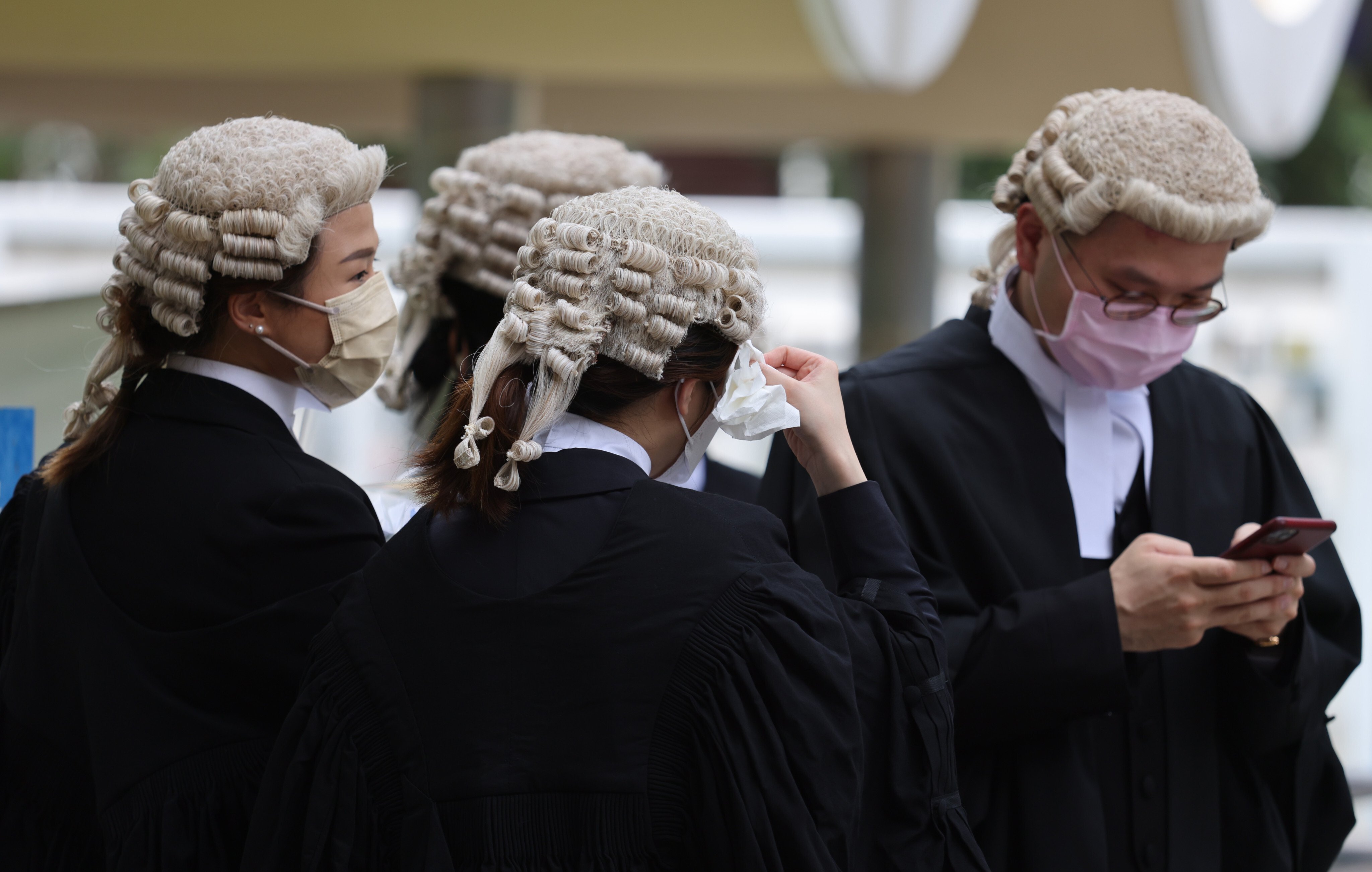 Legal practitioners feel the heat outside after an appointment ceremony for senior counsel at the Court of Final Appeal on May 29. Photo: Nora Tam 