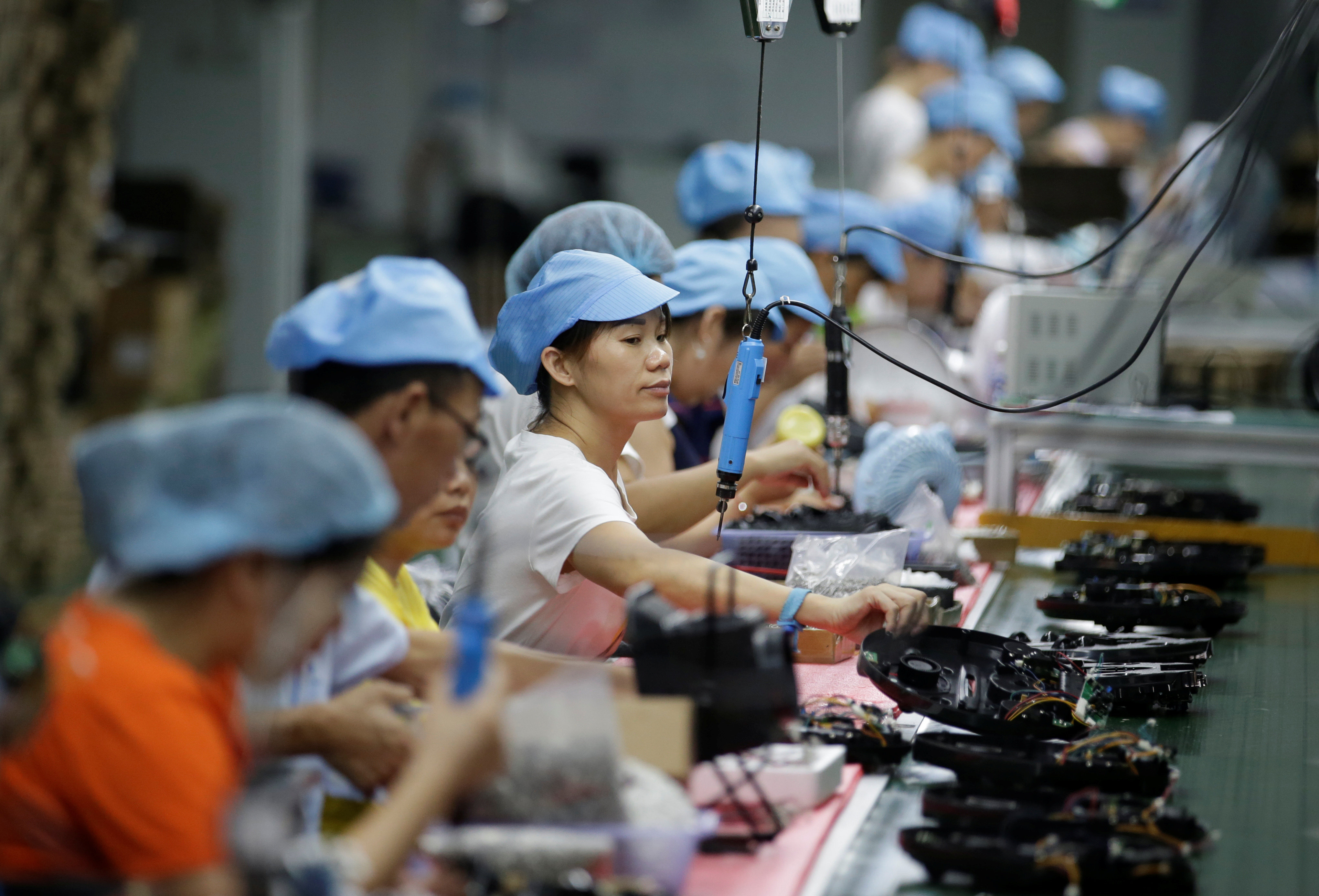 Employees work on the production line of a robot vacuum cleaner factory in Shenzhen in August 2019. China’s producer price index soared by 6.8 per cent year on year in April, reaching its highest level since October 2017. Photo: Reuters
