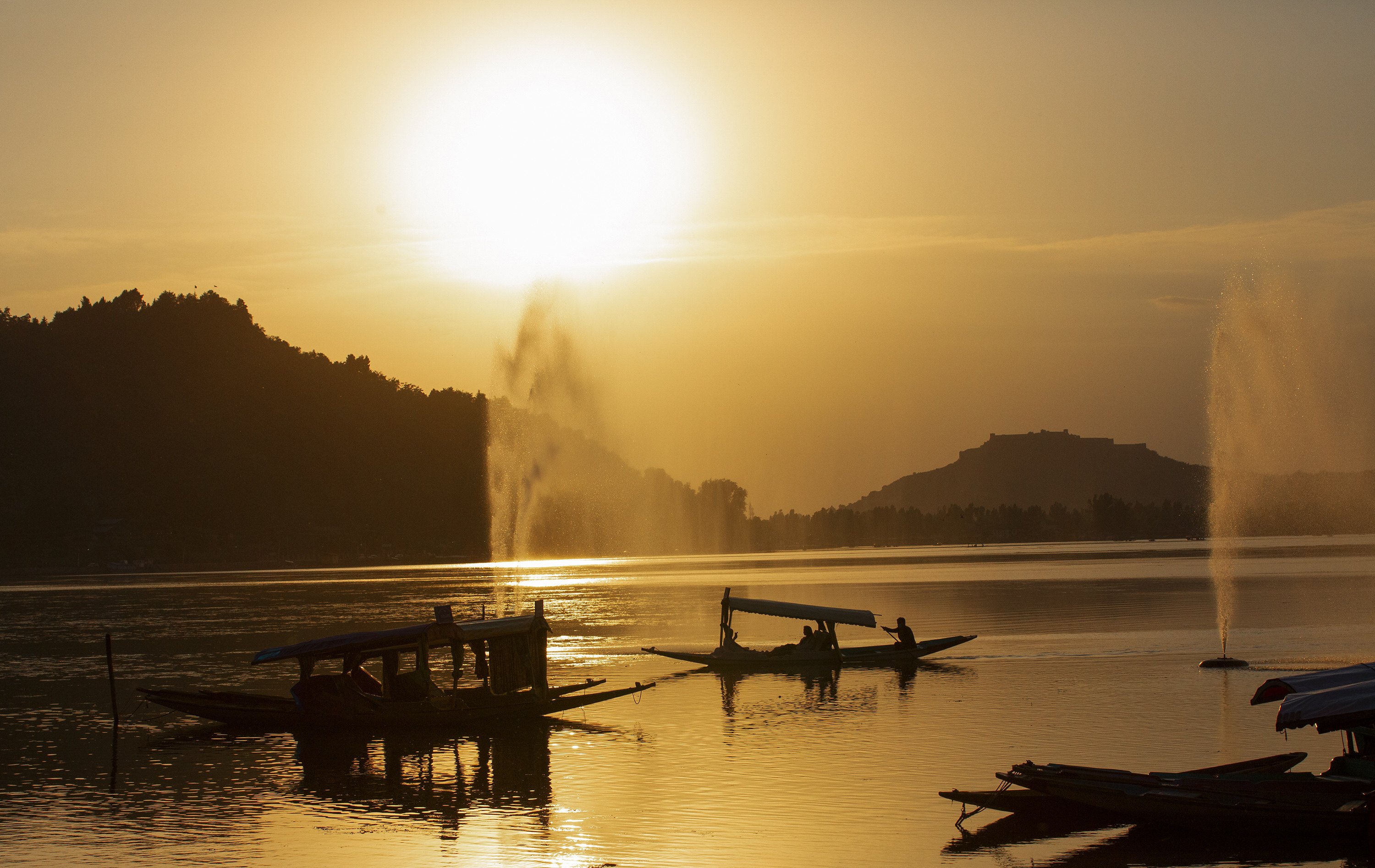 Small boats are seen at sunset on Dal Lake in Srinagar, the summer capital of Indian-administered Kashmir, earlier this month. Photo: Xinhua