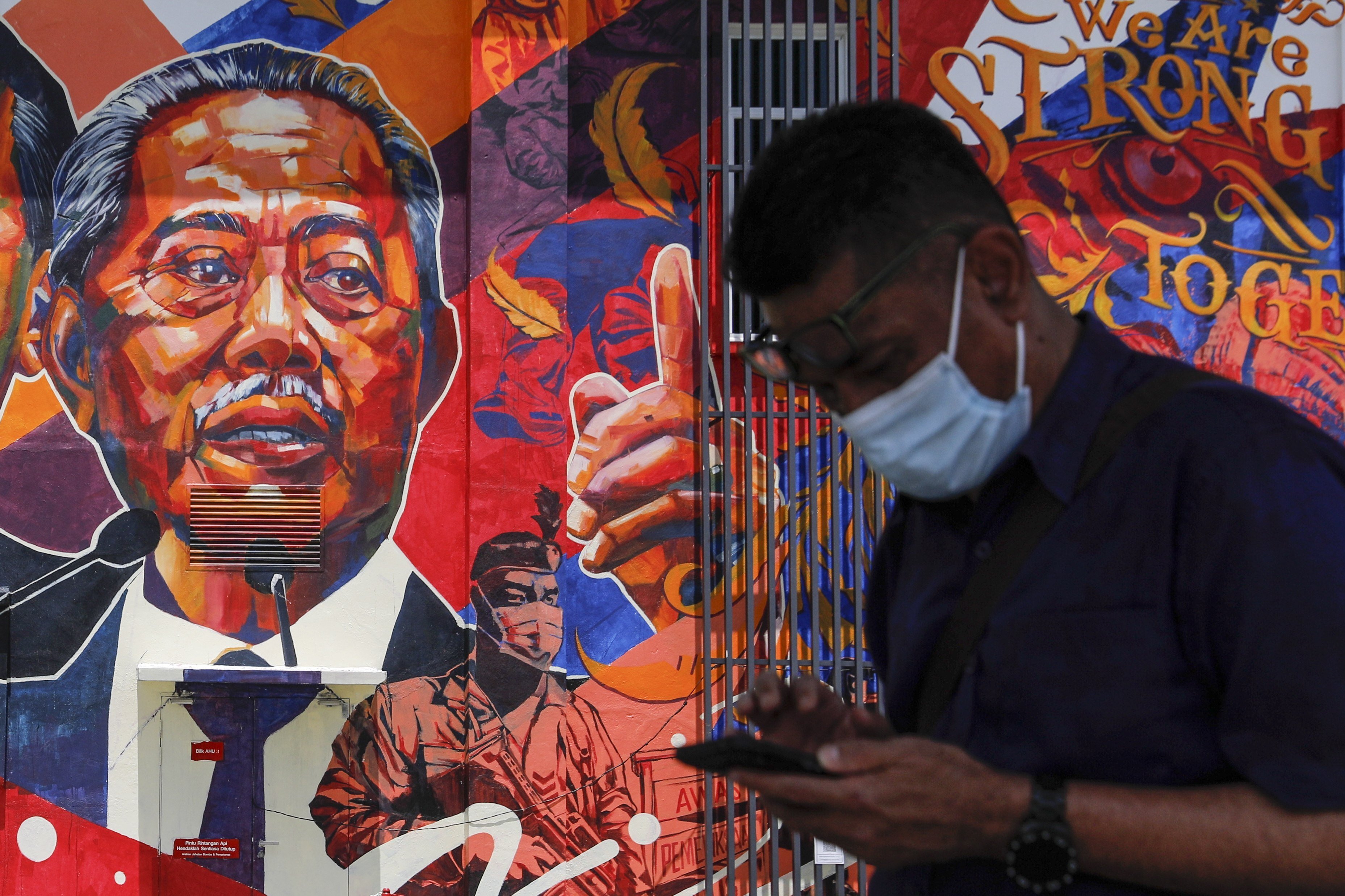 A mural depicting Malaysian Prime Minister Muhyiddin Yassin at government clinic in Kuala Lumpur. Photo: EPA