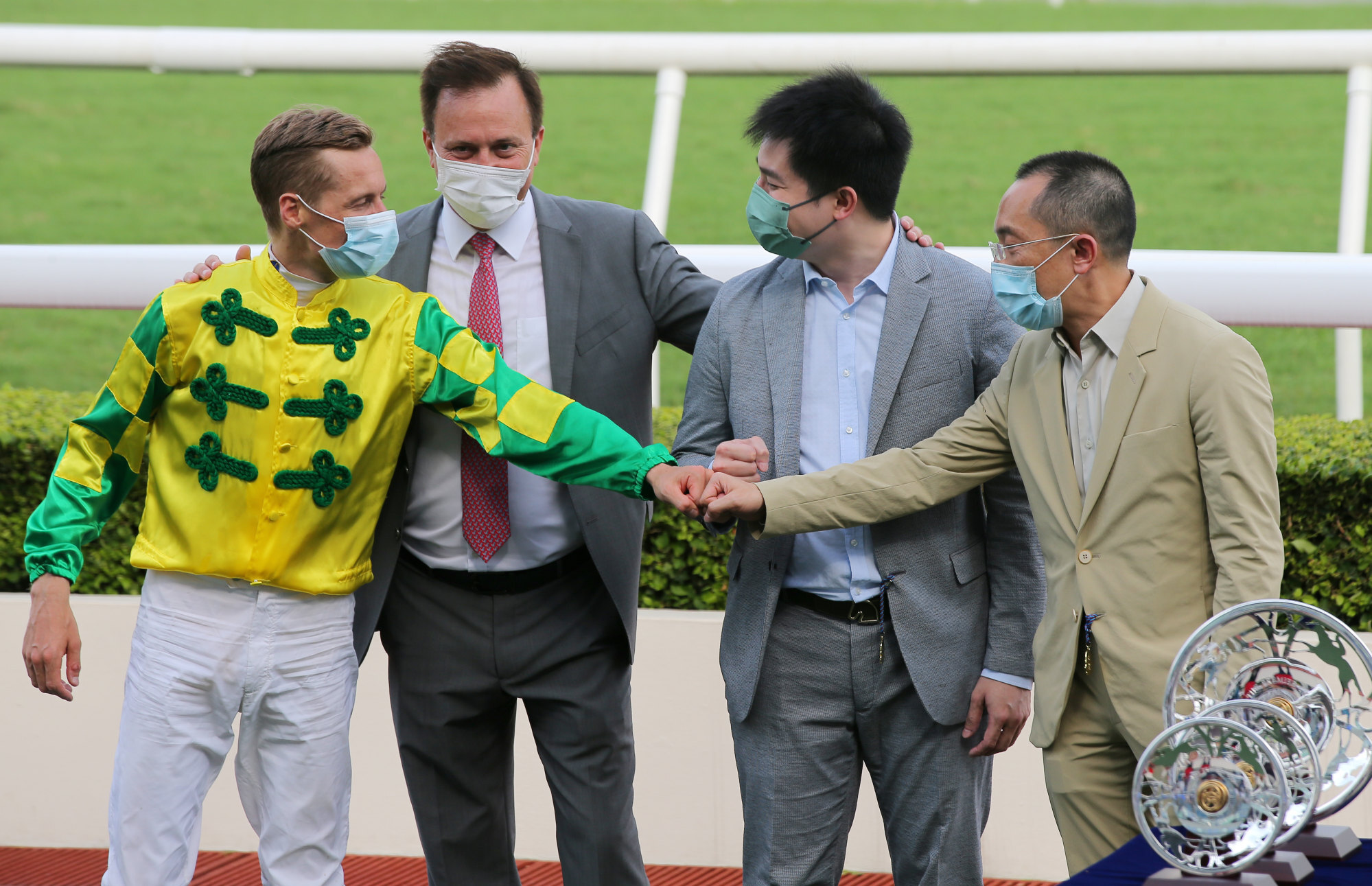 Jockey Blake Shinn and trainer Caspar Fownes with Sky Field’s connections, the Kwan family.