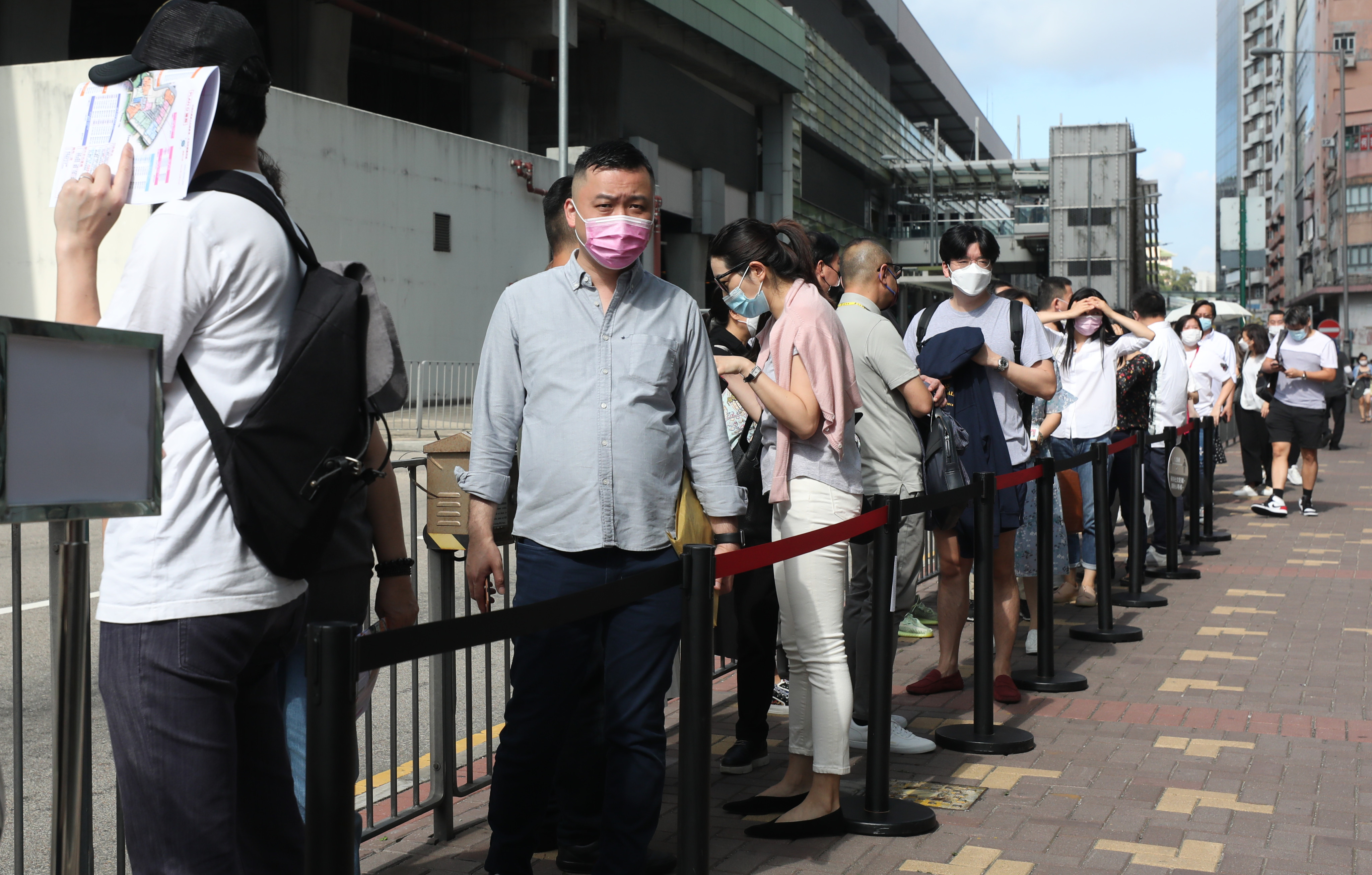 Potential buyers queue up to buy flats at the South Land project in Wong Chuk Hang, on May 15. Photo: Xiaomei Chen