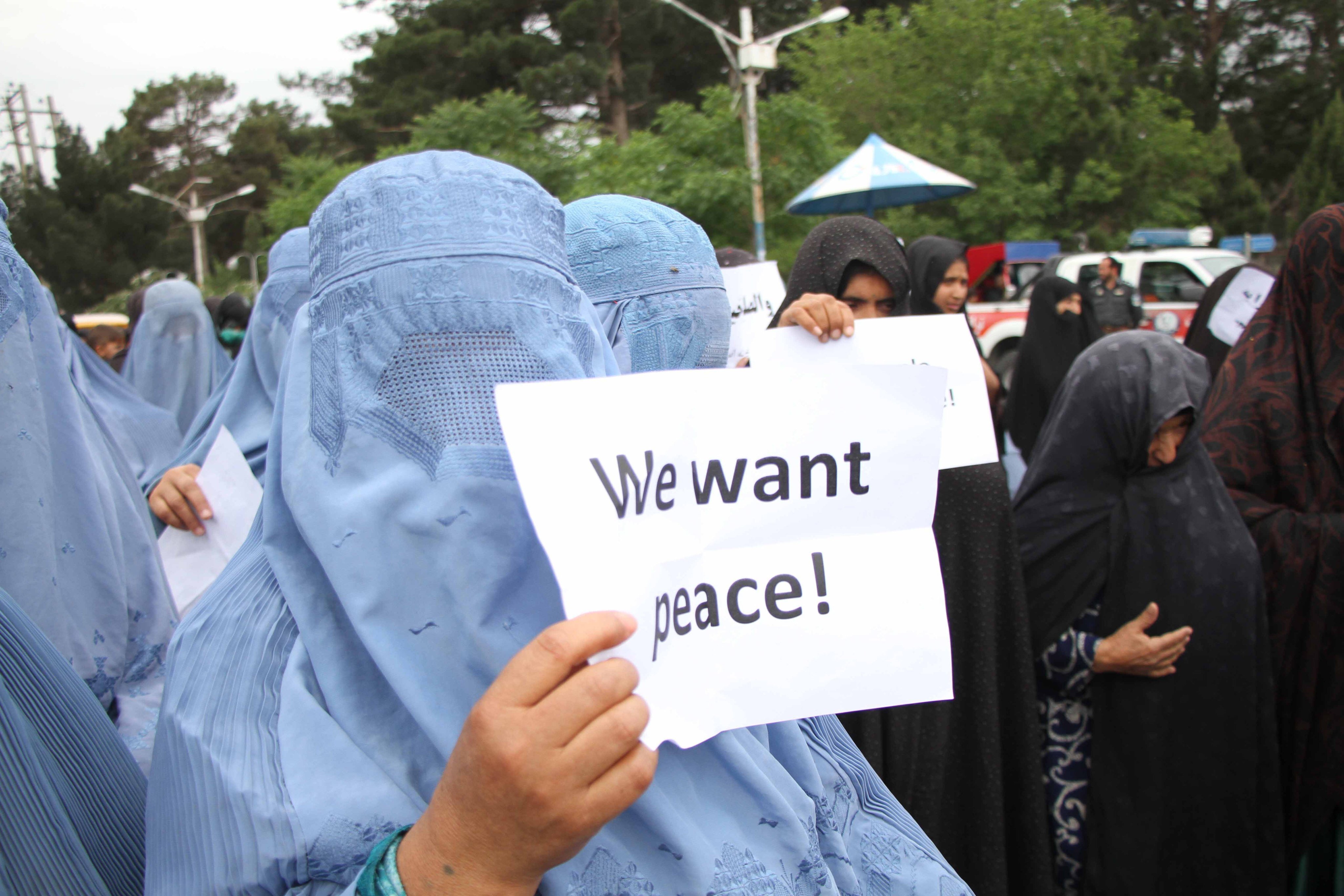 Afghan people hold placards during a protest to condemn violence in Herat, Afghanistan, on May 2. Photo: EPA-EFE