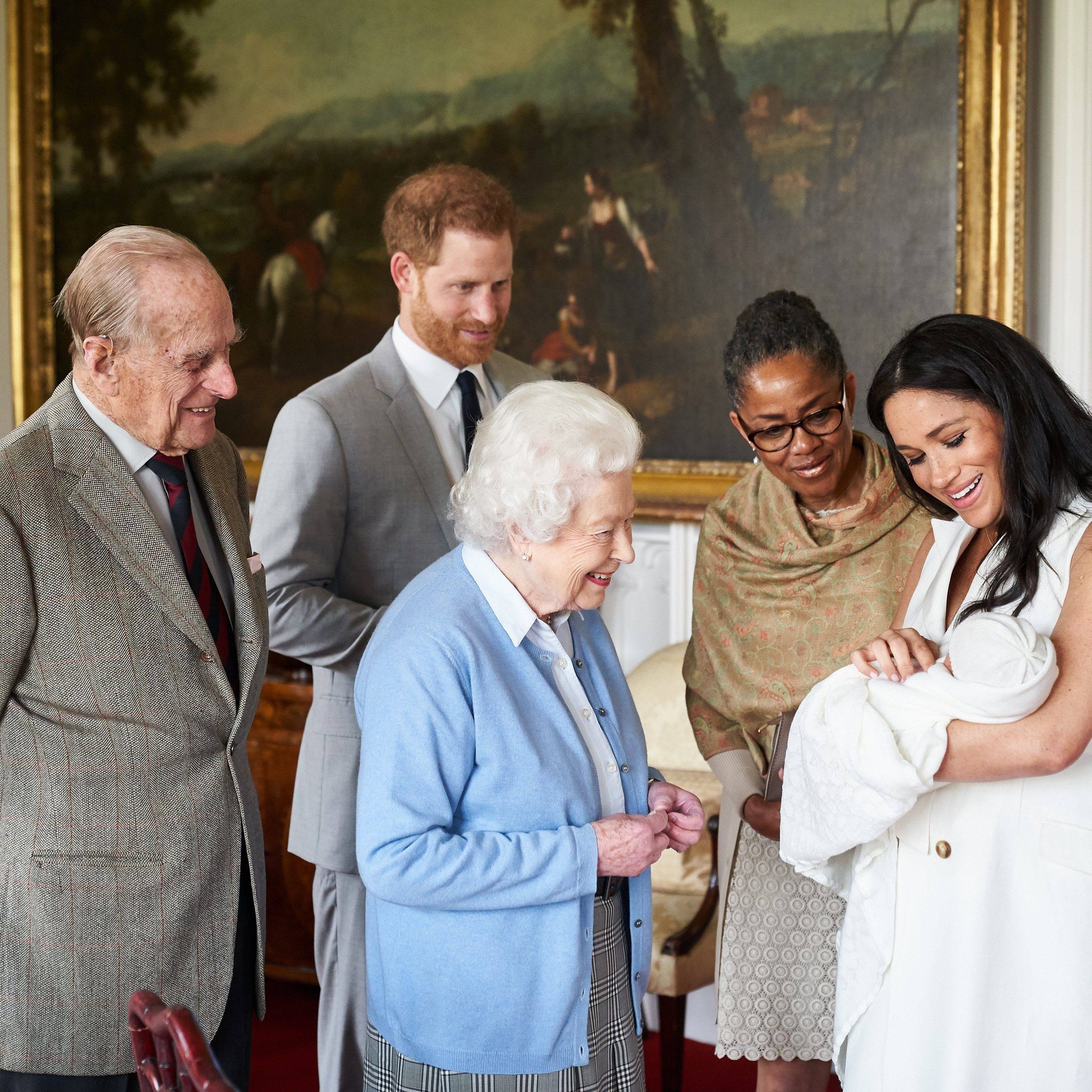 Britain’s Prince Harry, Duke of Sussex, and his wife Meghan, Duchess of Sussex, accompanied by Meghan’s mother Doria Ragland, showing their newborn baby son, Archie Harrison Mountbatten-Windsor to Britain’s Queen Elizabeth and Britain’s Prince Philip, Duke of Edinburgh, at Windsor Castle in May 2019. Photo: AFP