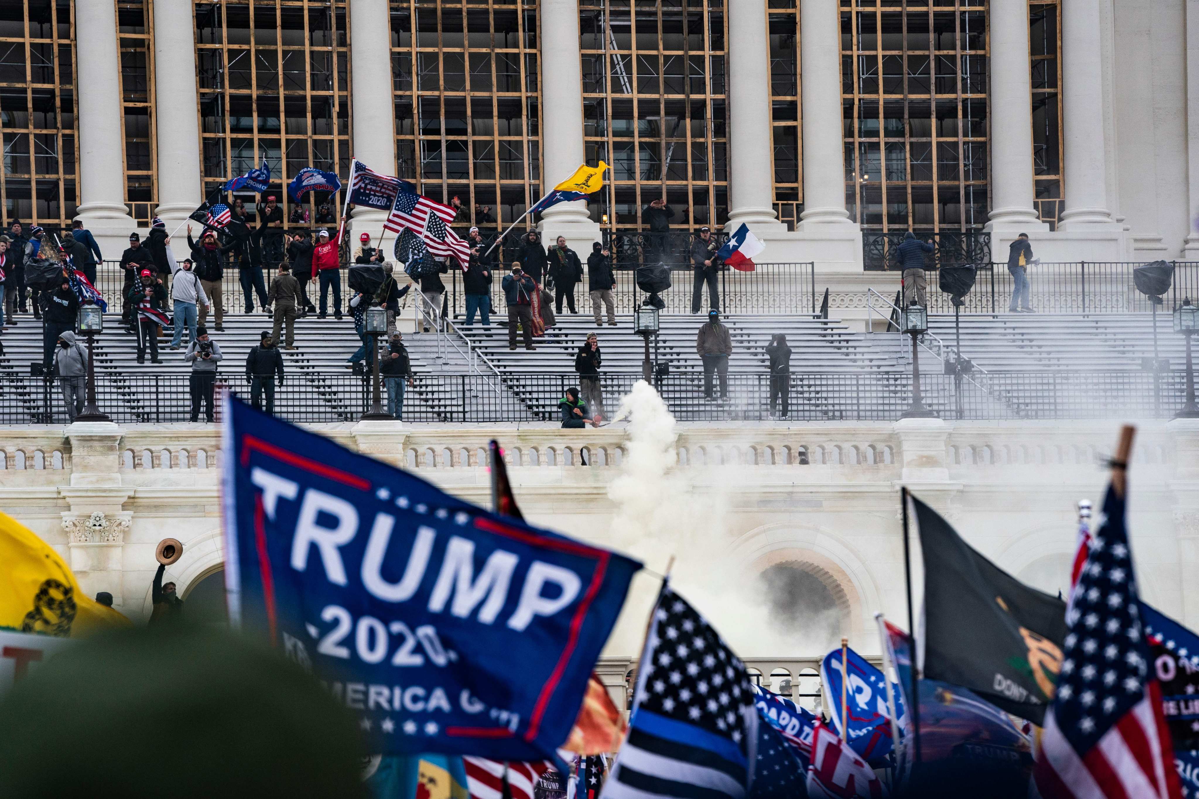 Supporters of Donald Trump clash with the US Capitol police during a riot at the US Capitol on January 6 in Washington. Trump’s supporters stormed a session of Congress held to certify Joe Biden’s election win, triggering unprecedented chaos and violence at the heart of American democracy and accusations the president was attempting a coup. Photo: TNS