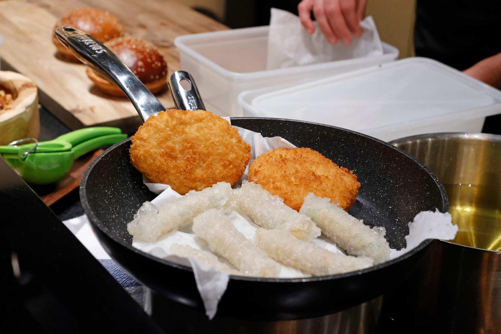 Burgers and rice rolls made with ‘cultured chicken’ meat. Photo: Jack Guez/AFP
