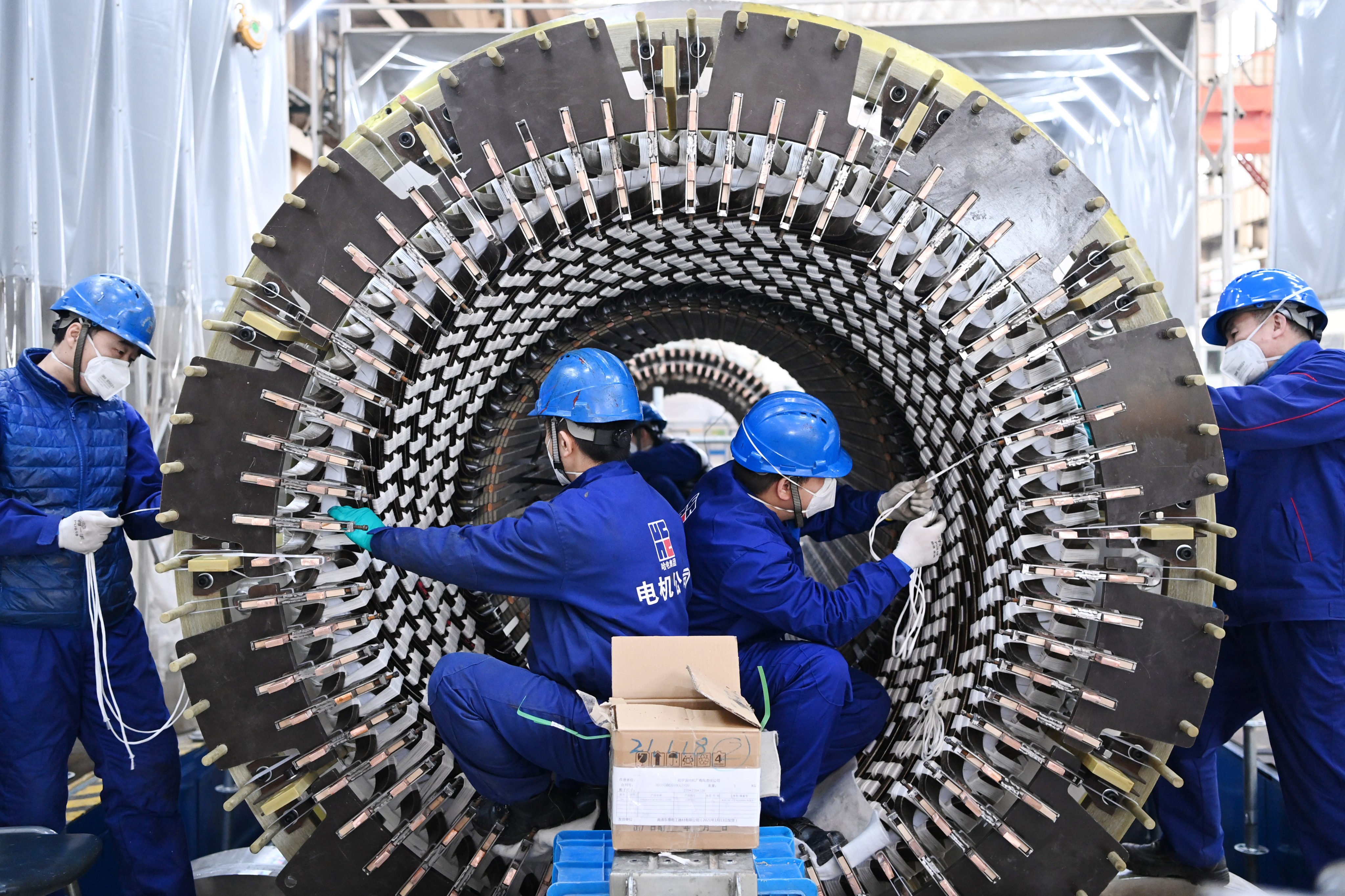 Workers are seen at the Harbin Electric Machinery Company in China’s Heilongjiang province, on February 22. Photo: Xinhua