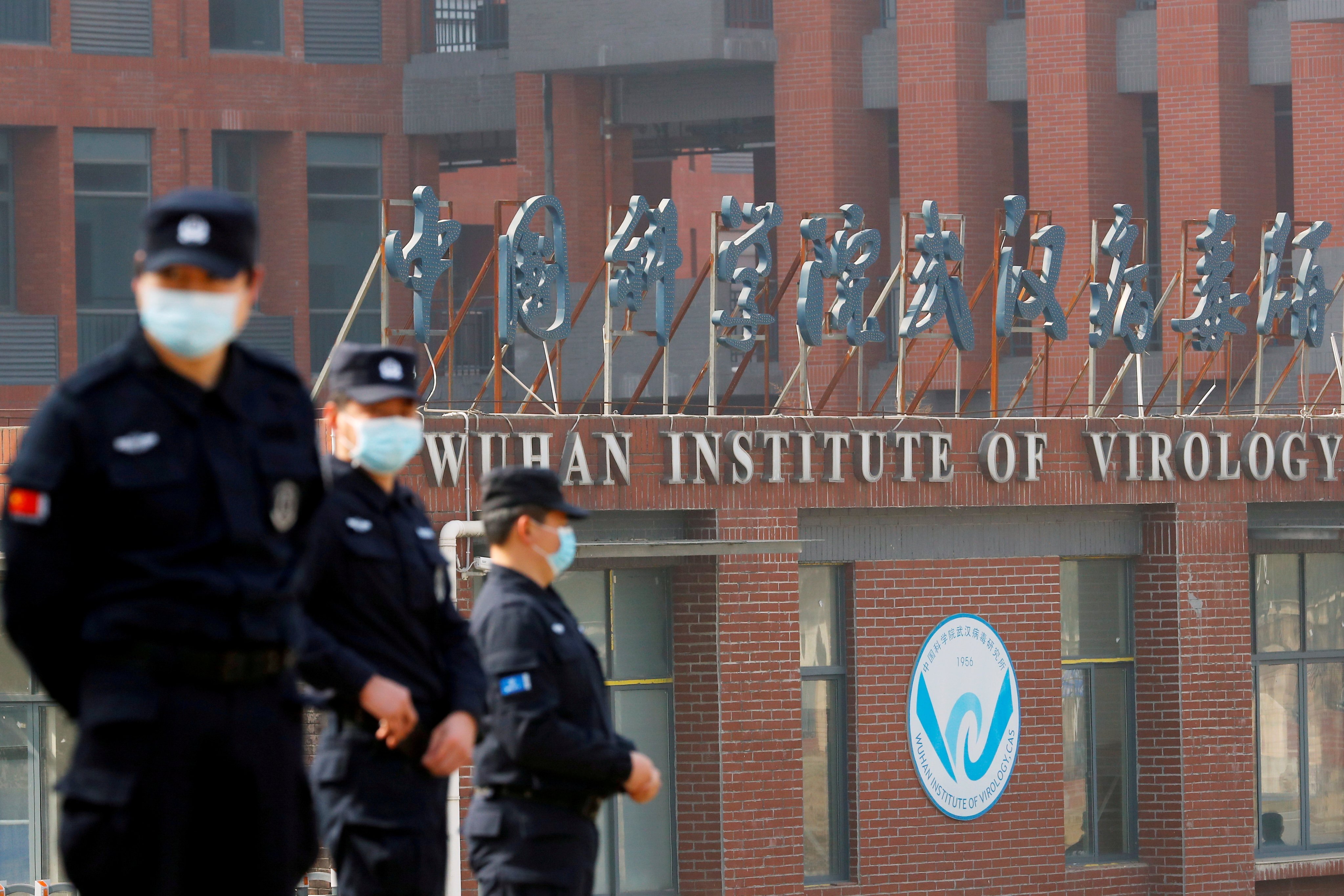 Security personnel keep watch outside the Wuhan Institute of Virology in Wuhan, Hubei province, during the visit by a WHO team tasked with investigating the origins of Covid-19,  on February 3. Photo: Reuters 
