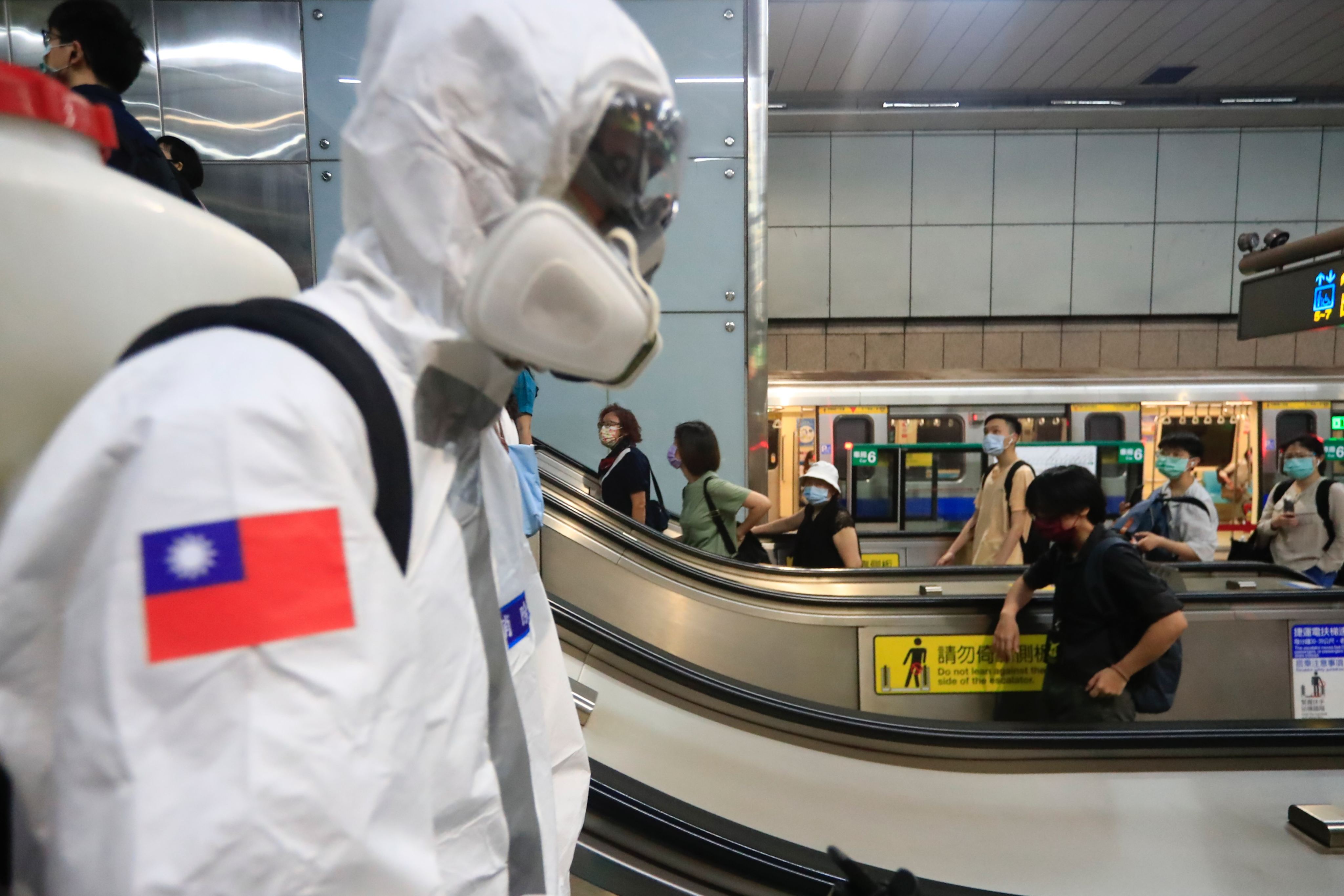Military officers disinfect public areas and transport in Taipei, Taiwan, on June 8, 2021, following a coronavirus outbreak across the island and an increasing number of deaths. Photo: NurPhoto via Getty Images