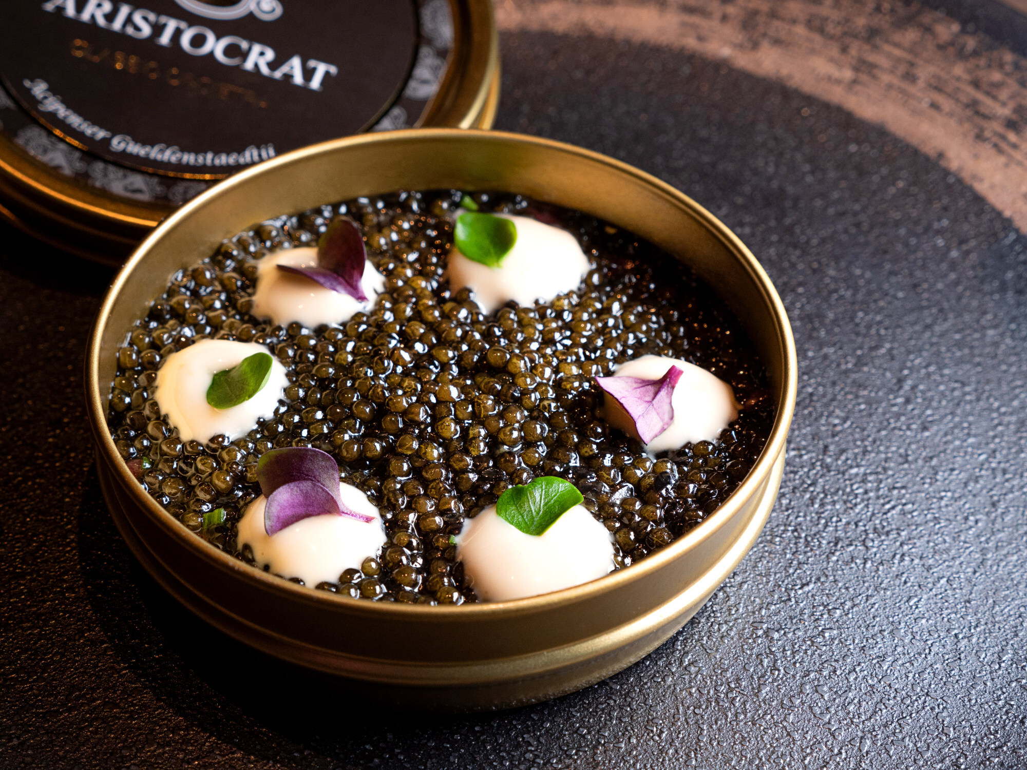 Black Angus beef tartare underneath a layer of caviar. Photo: Aria