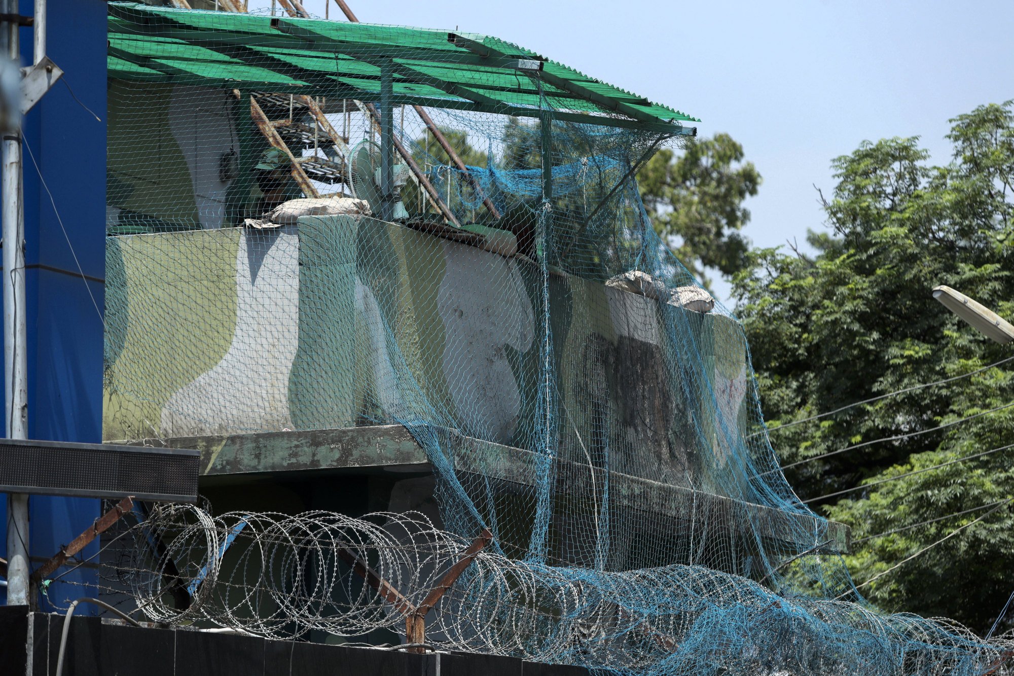 An Indian army soldier stands guard at the Jammu Air Force base after two drones dropped explosives that wounded two people. Photo: AP