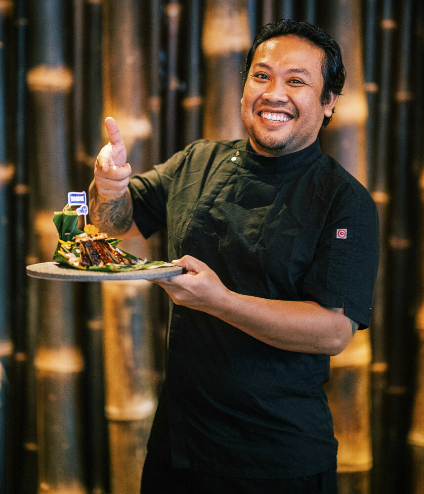 Chef Mustika Wayan of Poem restaurant with Tindle spinach chicken salad.