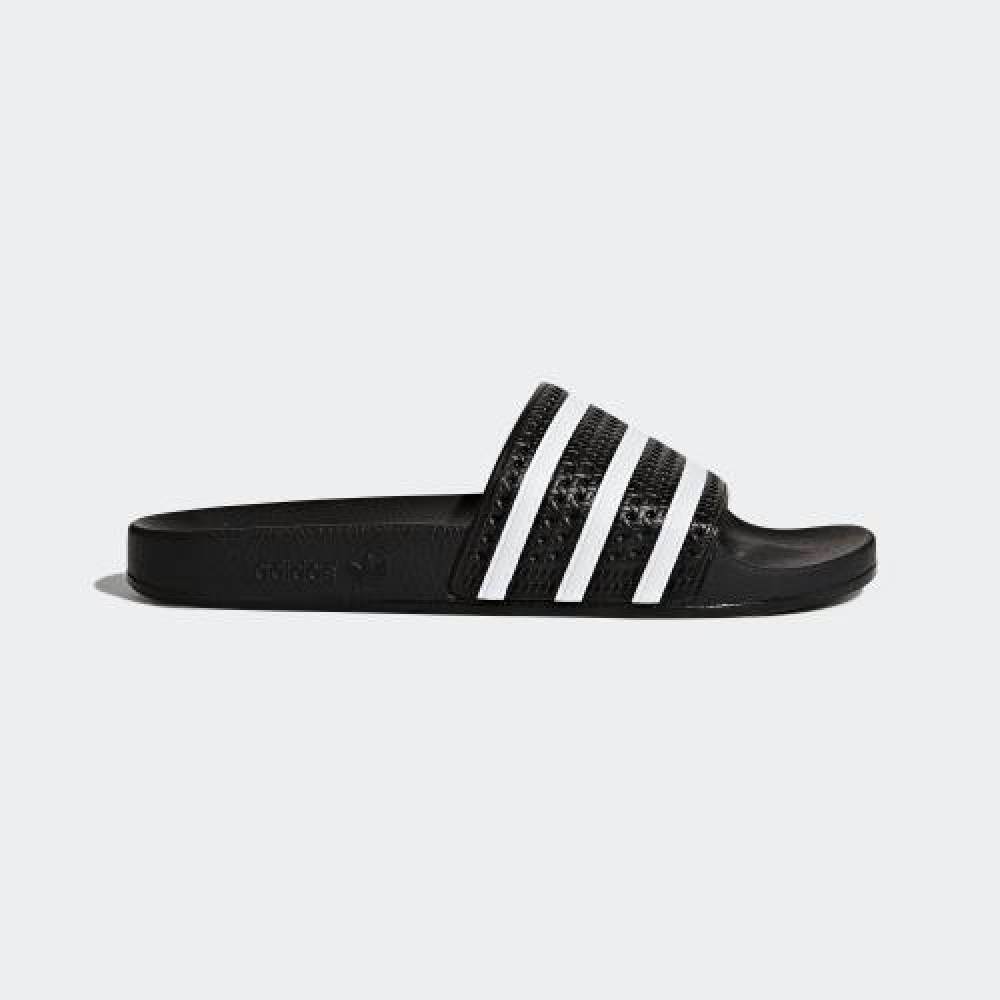 Adidas Adilette slides.