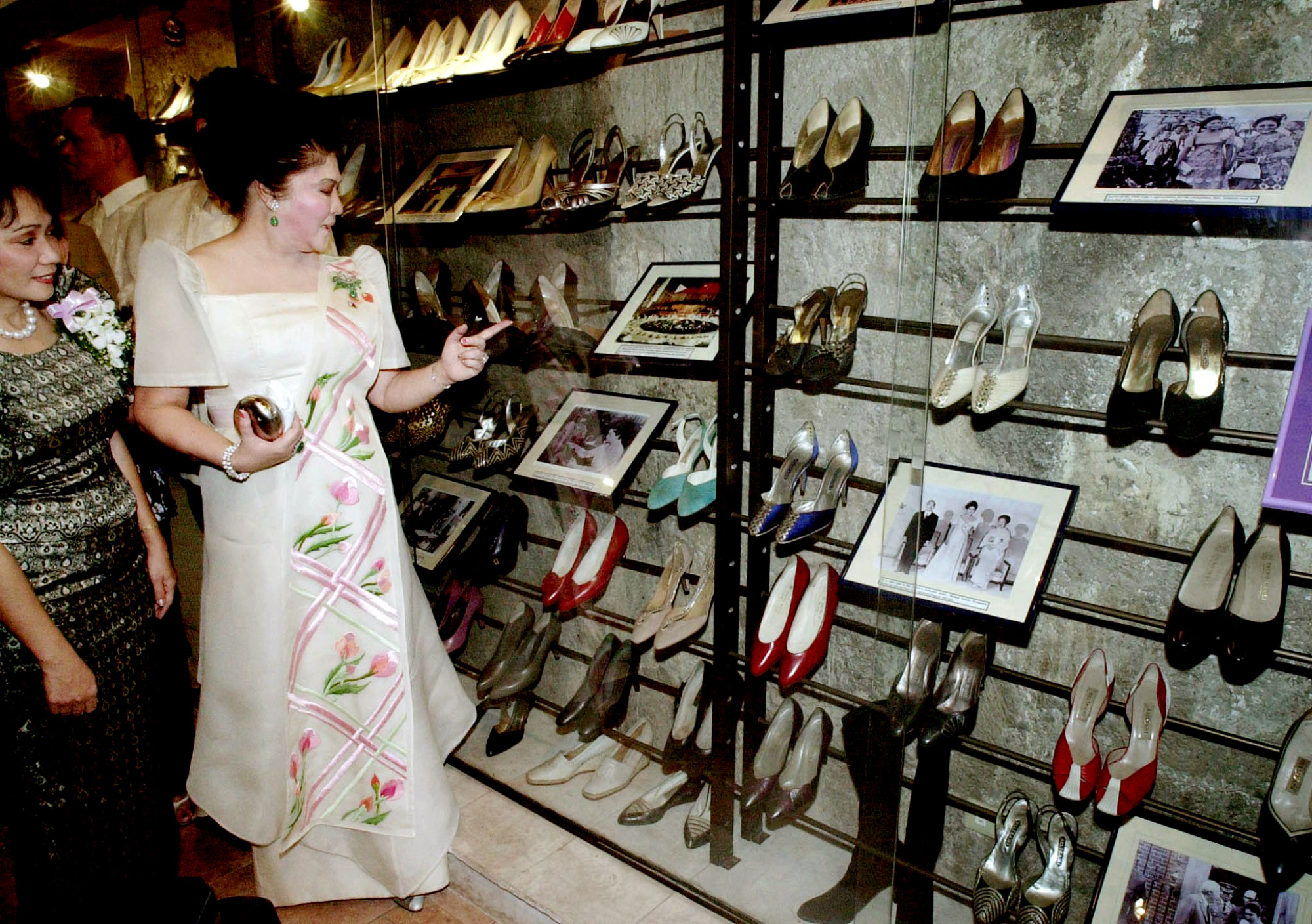 Former Philippine first lady Imelda Marcos looks at her shoe collection at the Marikina Shoe Museum. Photo: AFP