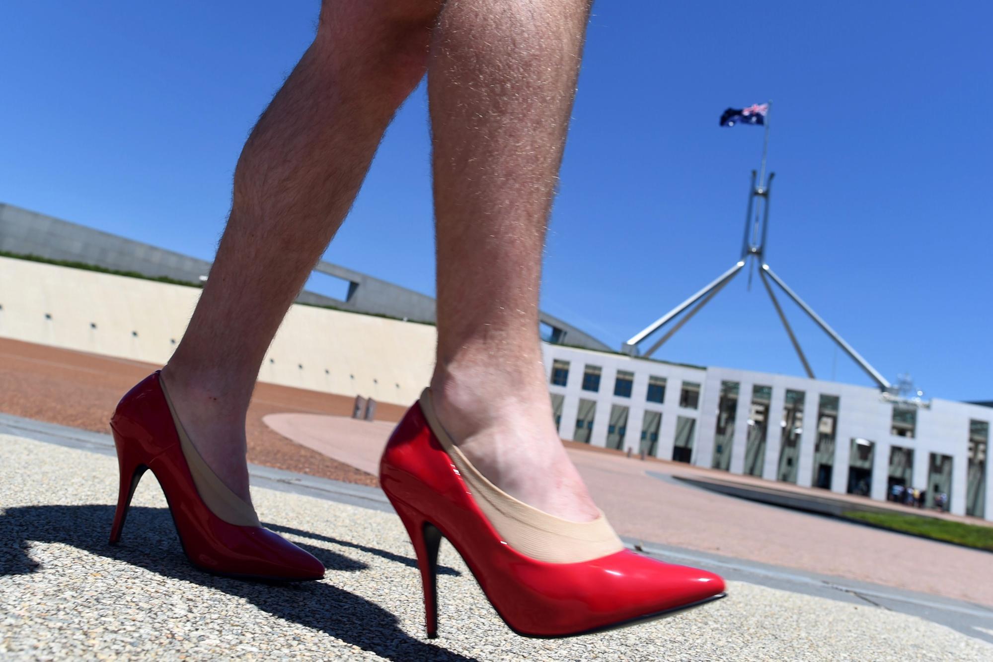 The Walk a Mile in Her Shoes campaign asks men to literally put themselves in women’s shoes as a way to confront gender stereotypes. Photo: EPA