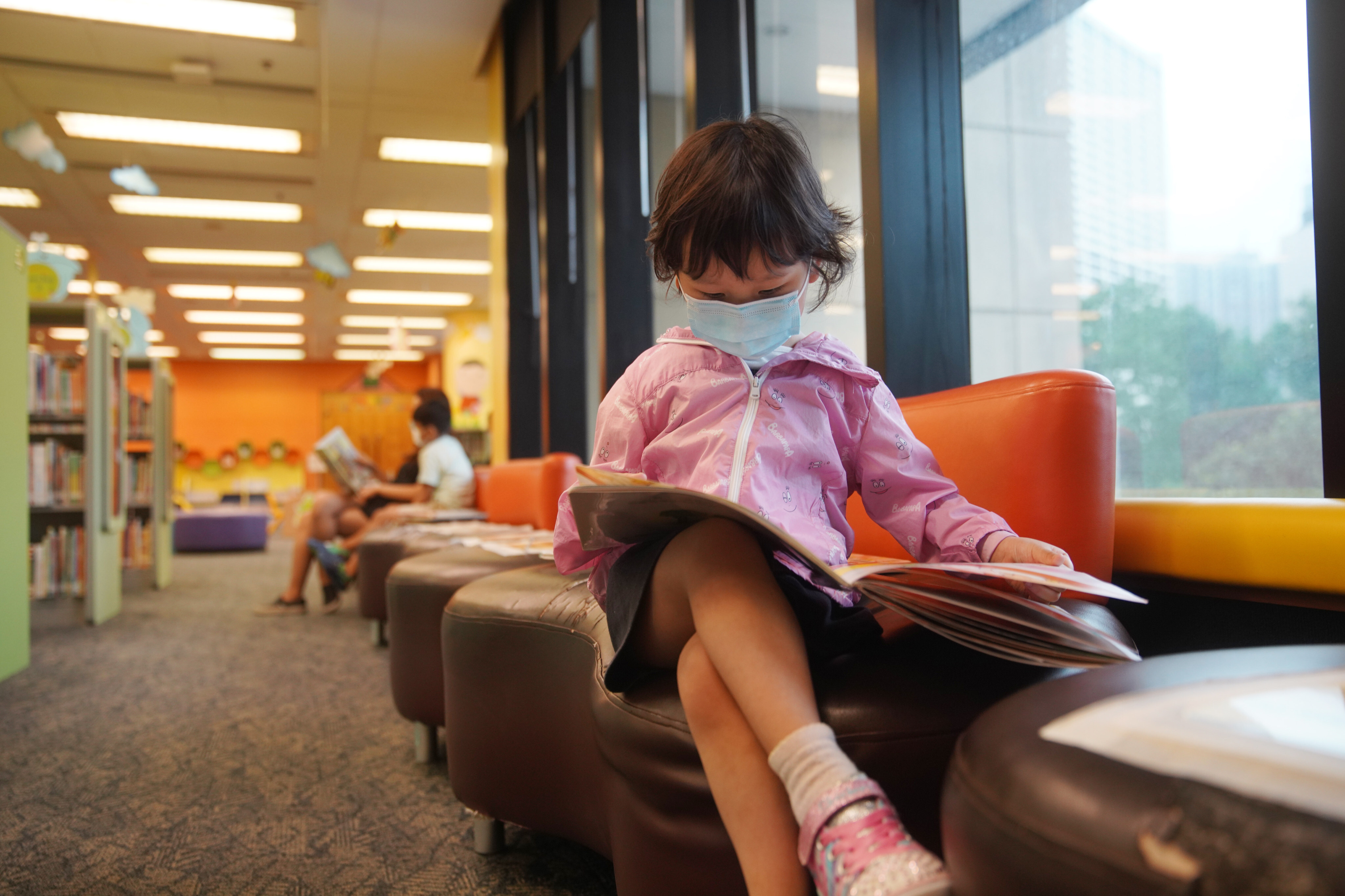 A child reads at the Hong Kong Central Library in Causeway Bay on September 28, 2020 after it re-opened to the public again following closures over another  coronavirus outbreak. Photo: Winson Wong