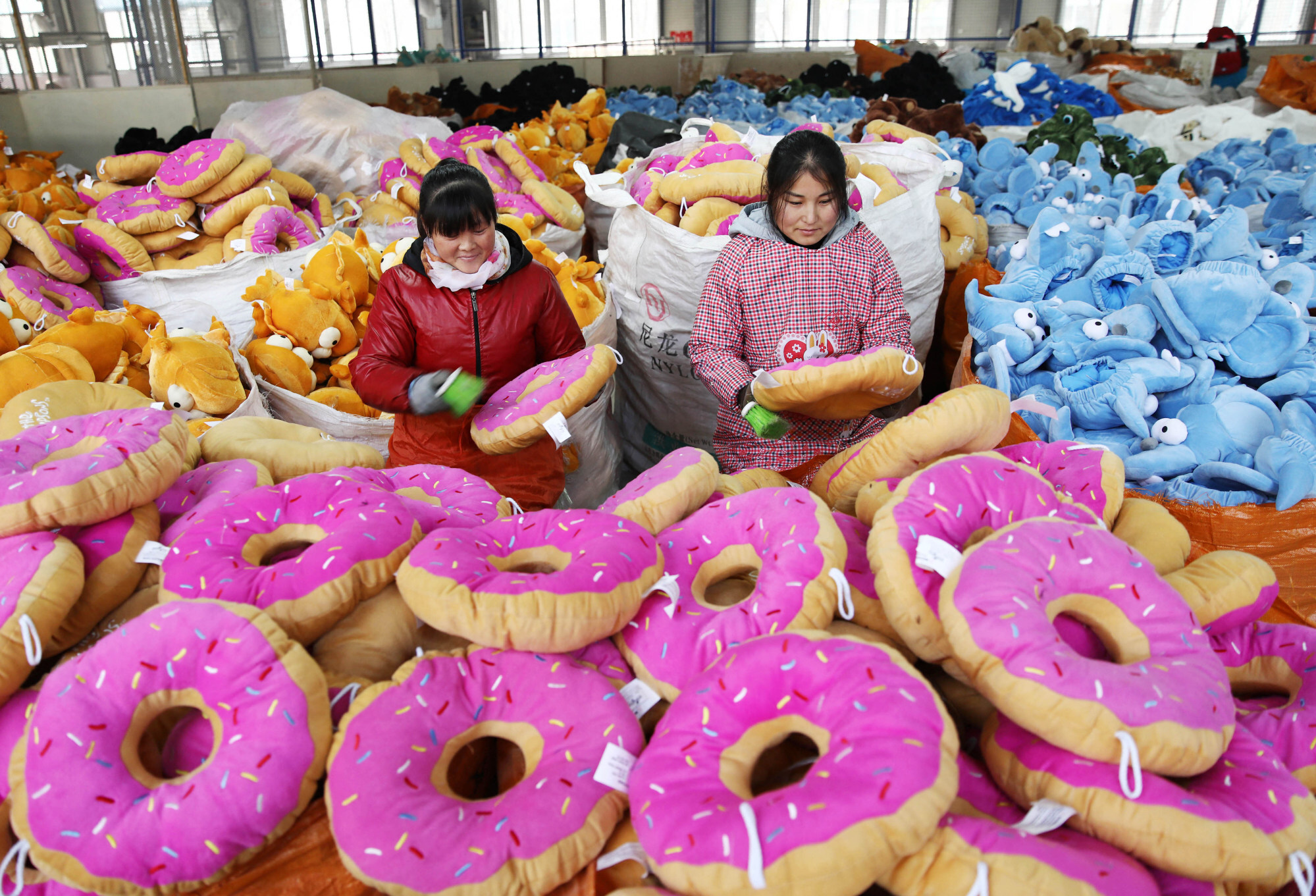 Women make toys for export at a factory in Lianyungang in east China’s Jiangsu province in January 2018. Photo: AFP