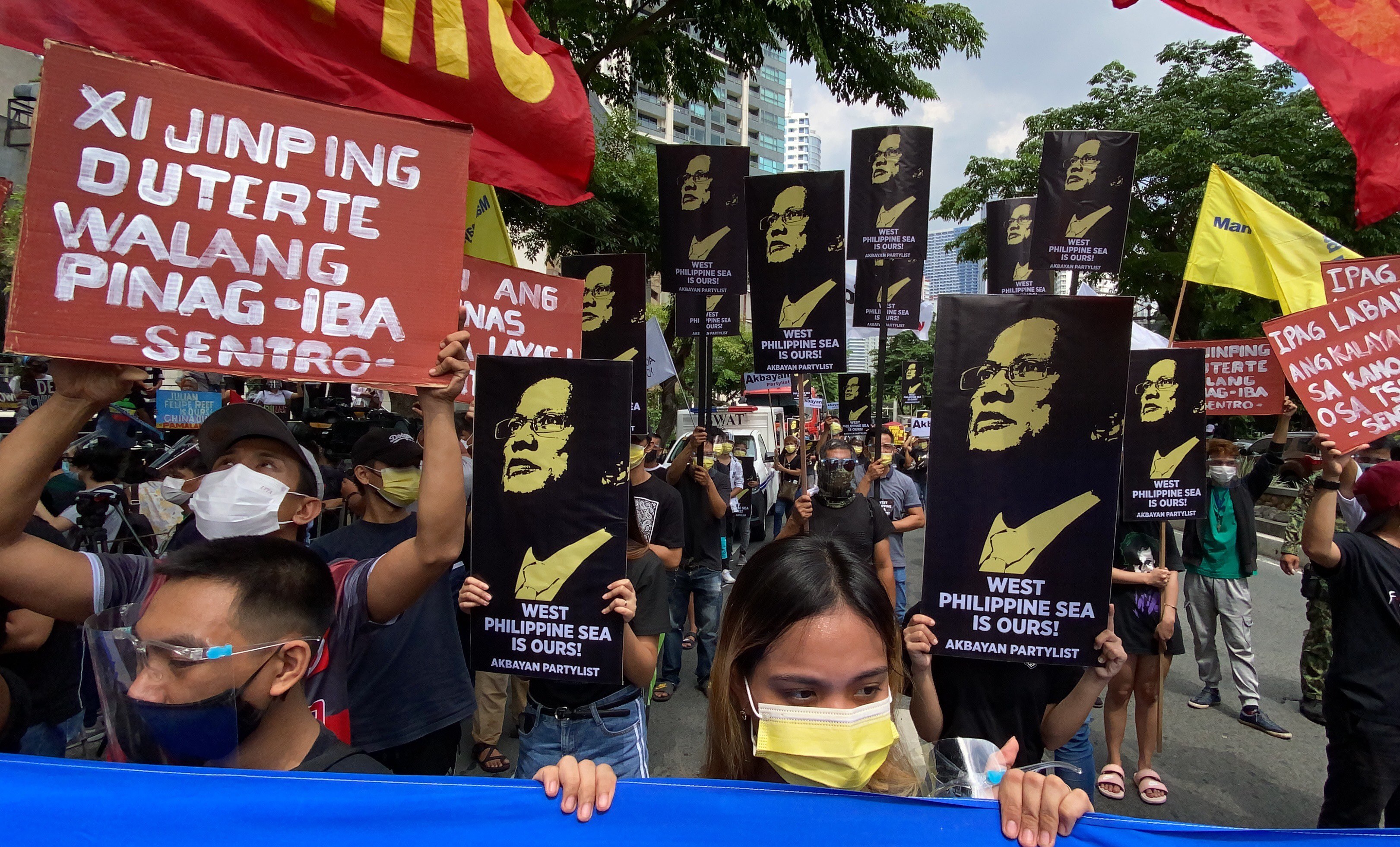 Filipino protesters hold placards during a rally outside the Chinese consular office in Manila on July 12. The demonstration marked the fifth anniversary of the country’s victory at the Permanent Court of Arbitration in favour of the Philippines’ claims in the South China Sea. Photo: EPA-EFE