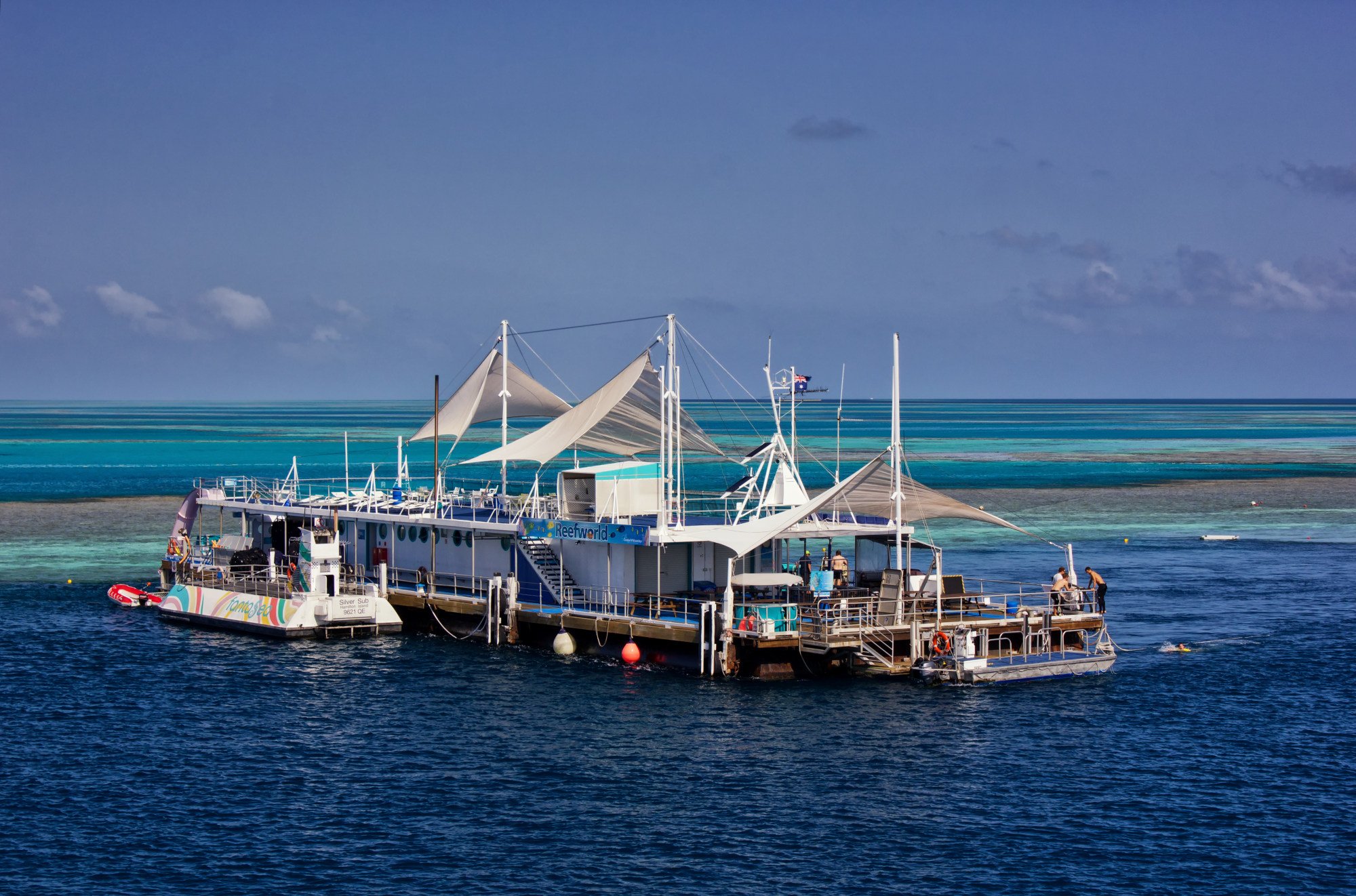 The Reefworld pontoon, where visitors can snorkel, dive, ride a semi-submersible or stay overnight. Photo: Shutterstock