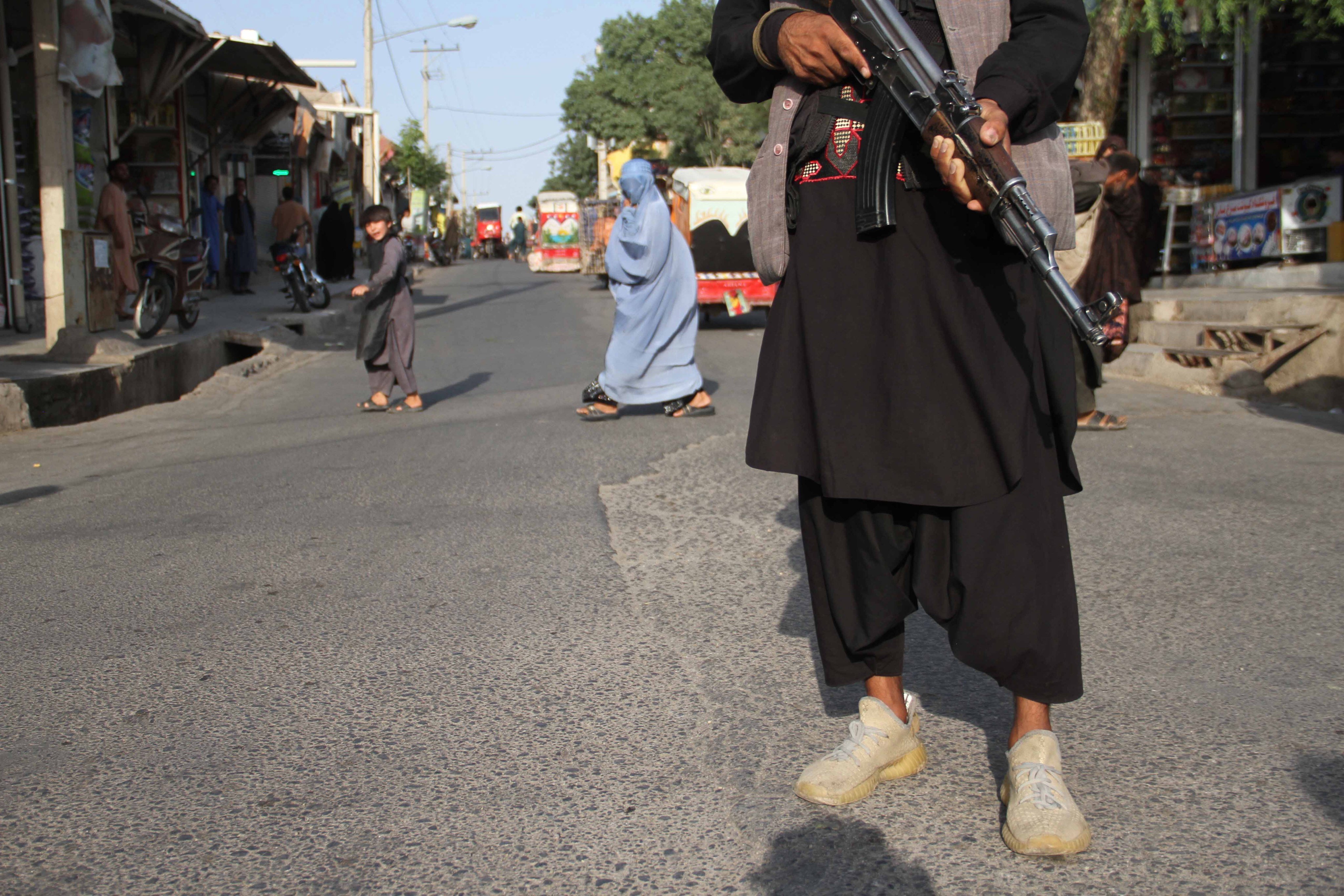 An armed supporter of a former Mujahideen commander stands guard on a roadside checkpoint in Herat, Afghanistan, on July 13. The Taliban are pressing on with their surge in Afghanistan ahead of US troop withdrawal, raising fear of reprisals on Afghanistans who supported the foreign troops. Photo: EPA-EFE
