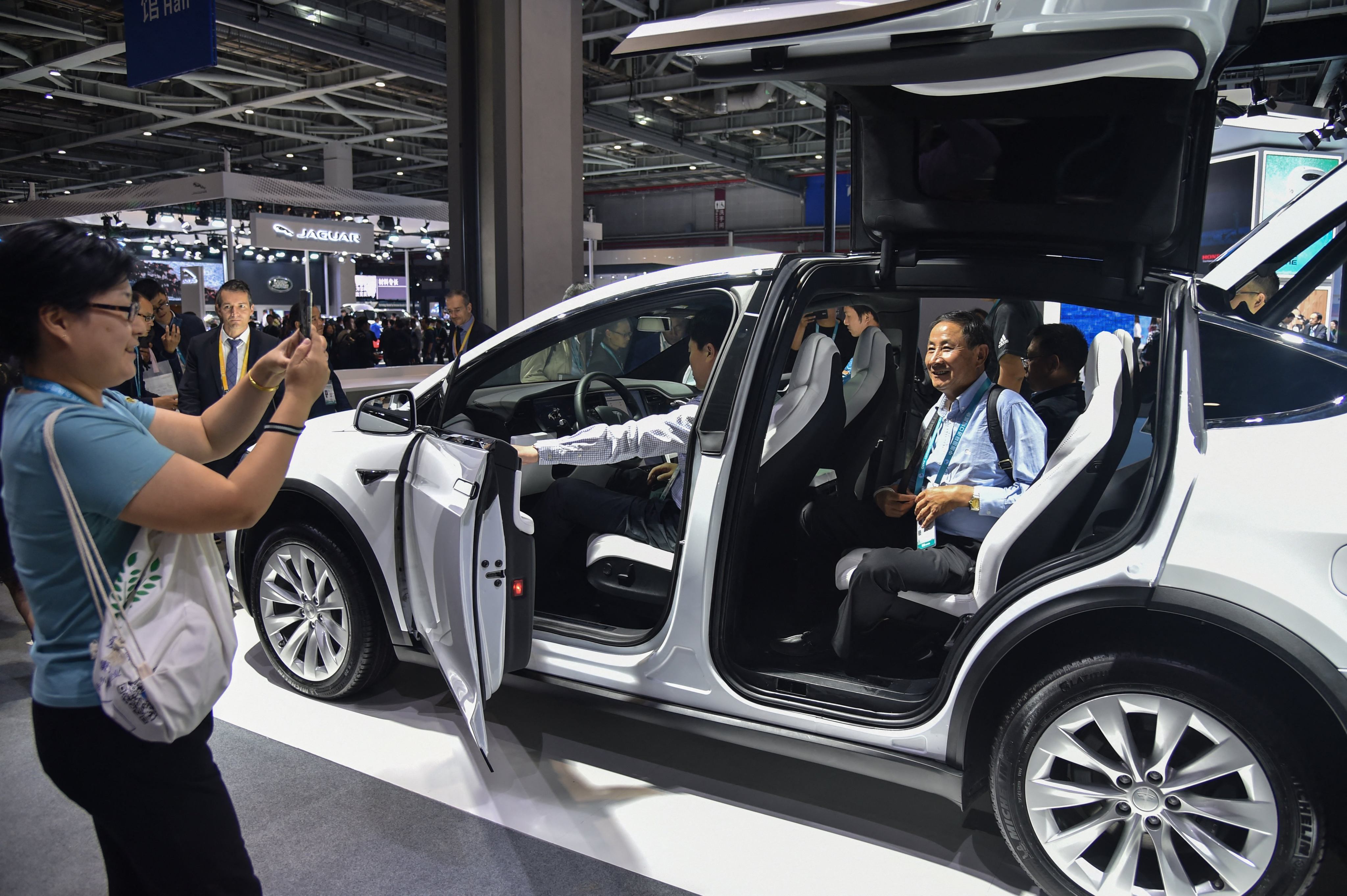 People check out a Tesla car at the China International Import Expo in Shanghai in 2019. Photo: AFP