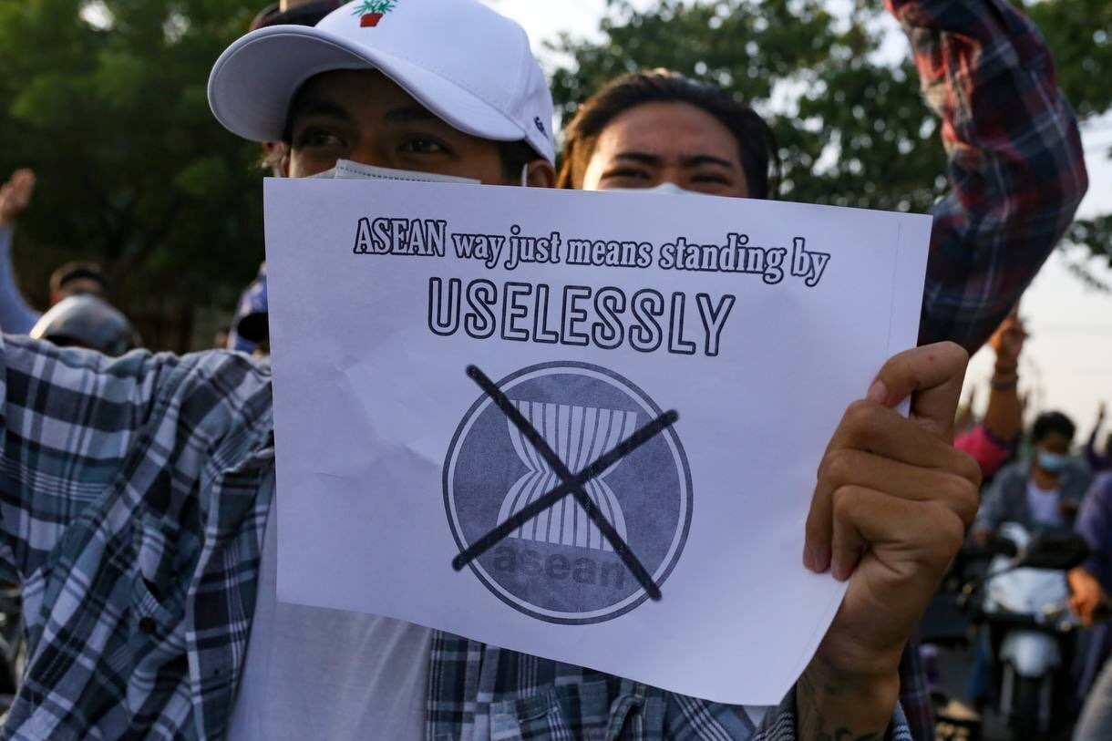 A protester against Myanmar’s junta holds a placard criticising the Association of Southeast Asian Nations in Mandalay, Myanmar, on June 5. Photo: Reuters